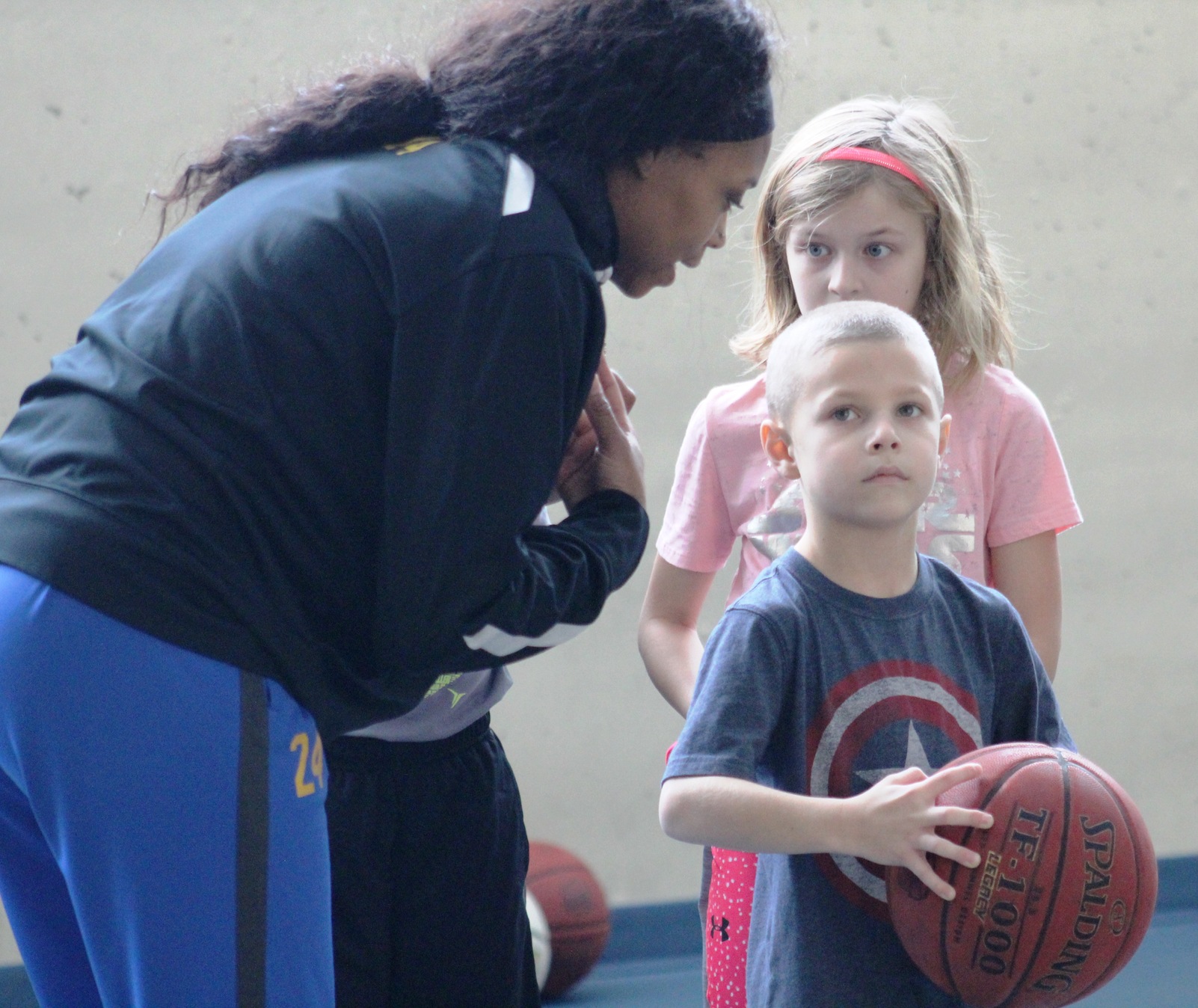 NIACC women's basketball player Khalilah Holloway helps at the skills clinic Sunday in the NIACC recreation center.
