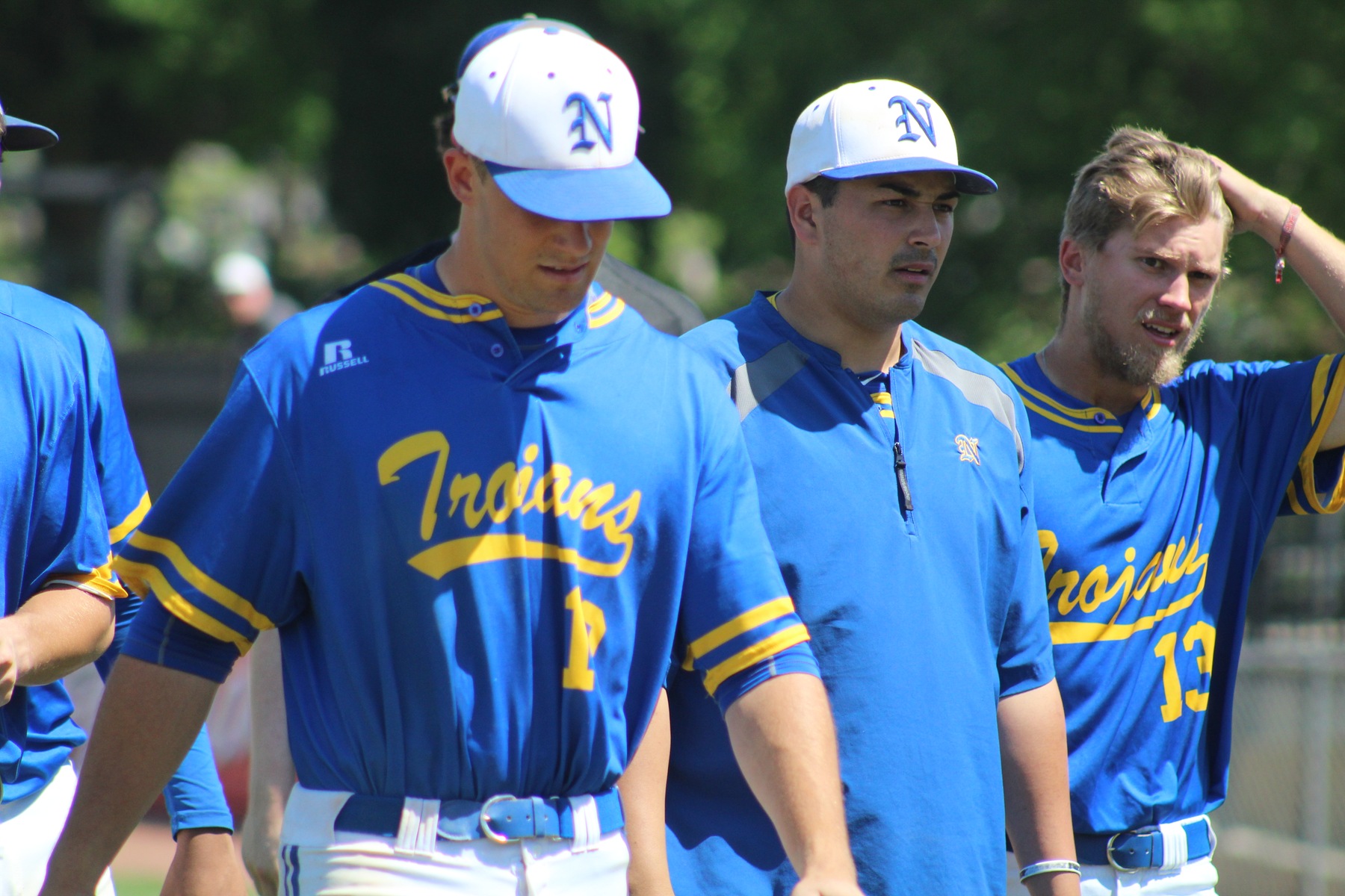 NIACC's Brandon Michie (left), Jarod Large (center) and Connor Enochs walk off the field after bowing out at the regional tournament on Sunday.