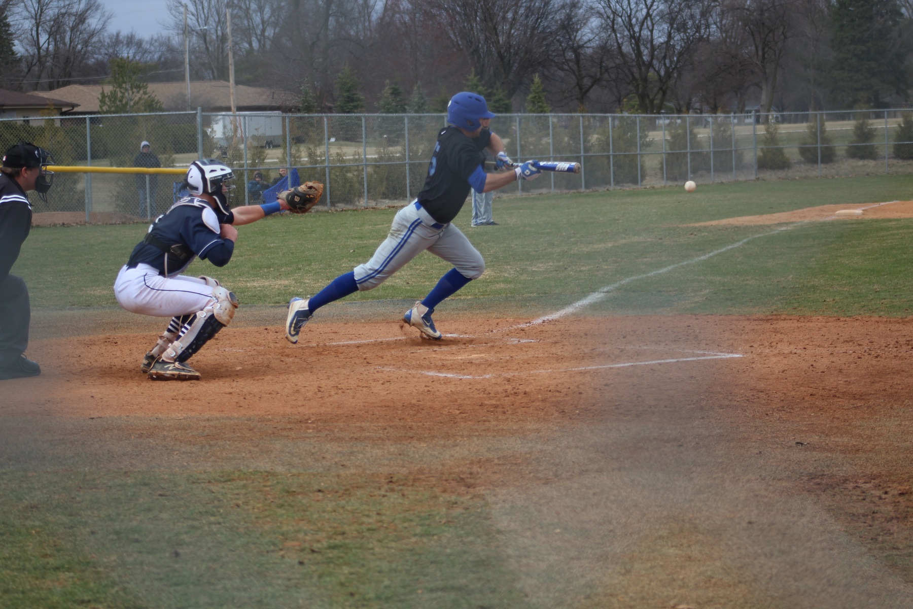 Aaron Kubal puts down a bunt during the second game of doubleheader on Monday.