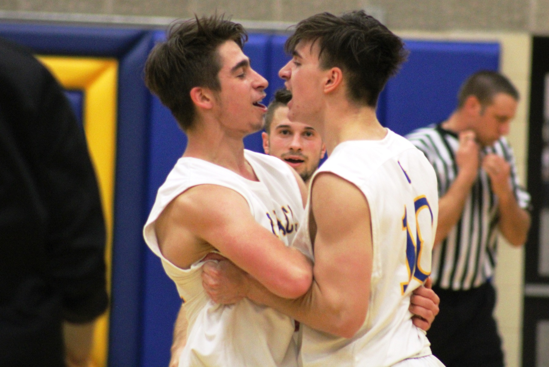 Brad Rathjen (right) and Nick Wurm celebrate after Wednesday's 64-63 victory over DCTC. Rathjen hit the game-winner with a driving layup with about 10 seconds left in the game.