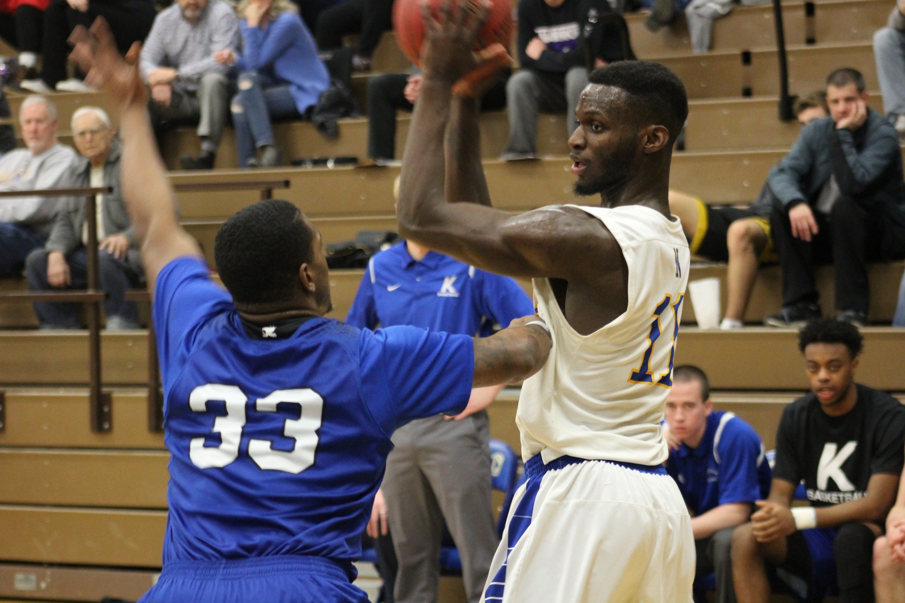 NIACC's Tim Trousell looks to make a move as he's defended by Kirkwood's Da'Rion King.