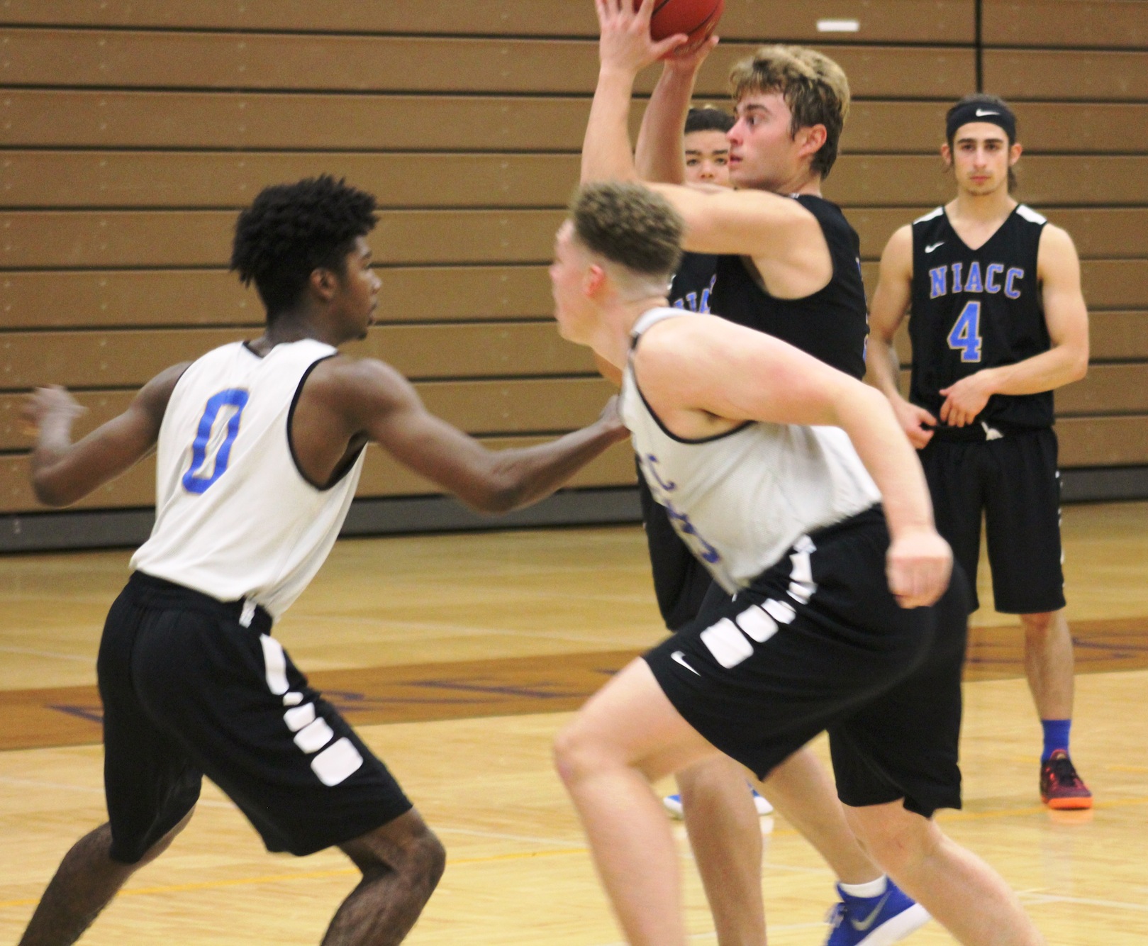 Freshman Mac Skogen looks to pass during Monday's practice in the NIACC gym.