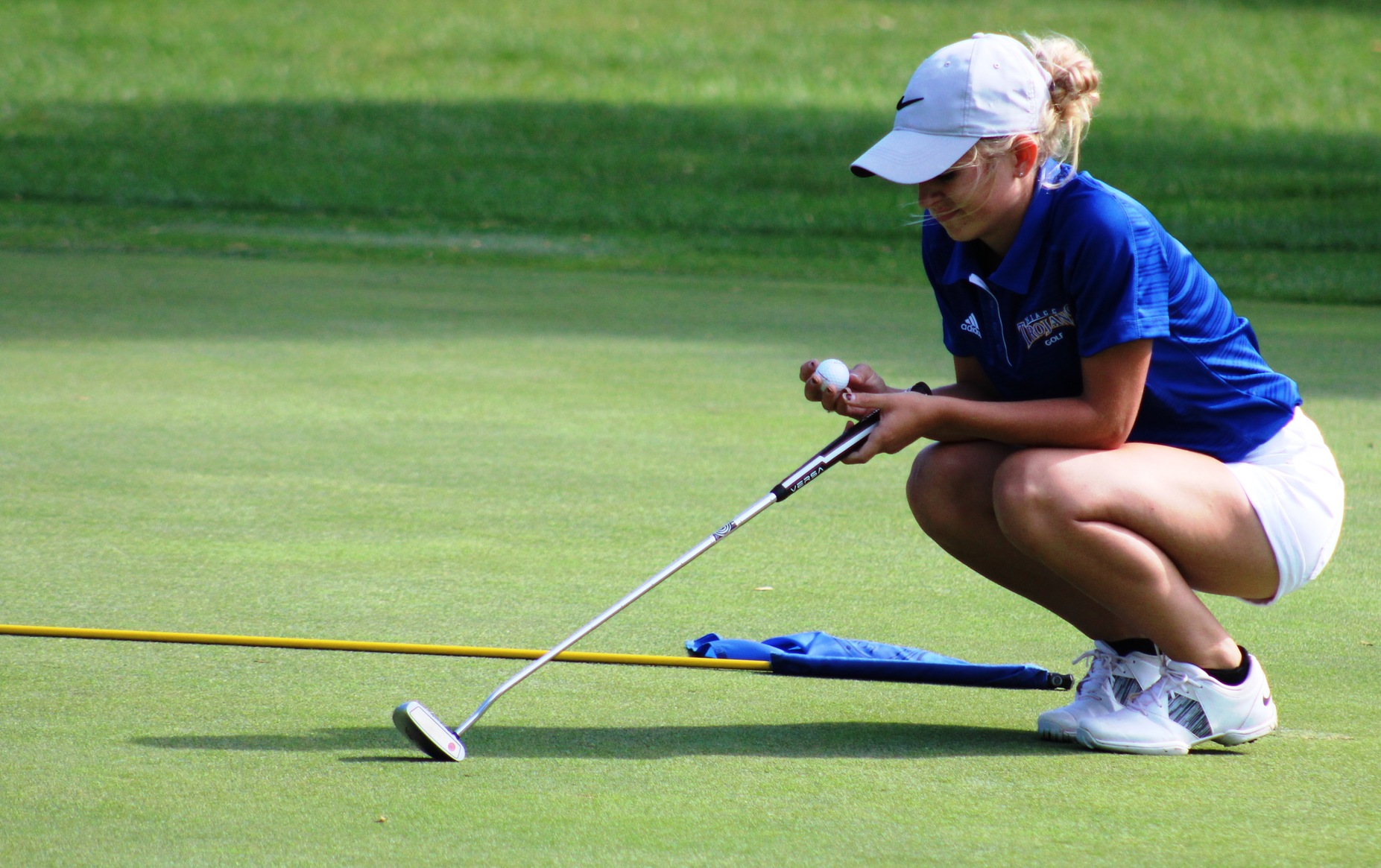 Courtney Tusler lines up a putt at a fall tournament at the Fort Dodge Country Club.