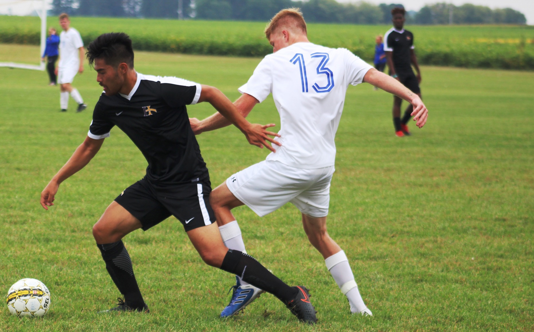 NIACC's Aidan de Boer (13) battles for the ball in a match against Indian Hills last month.