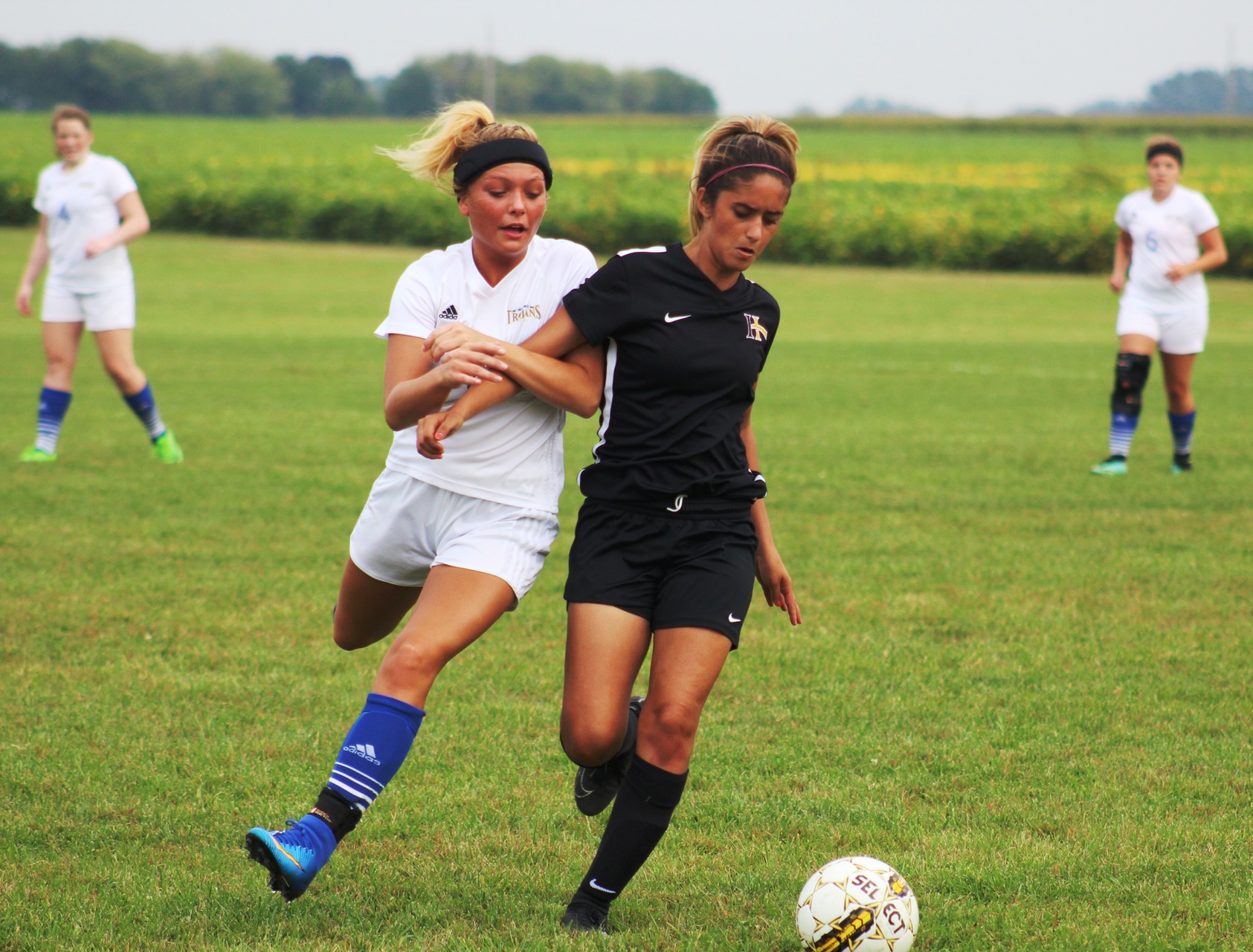 NIACC's Jasmin Benedict fights for the ball in the first half of Saturday's match against Indian Hills.