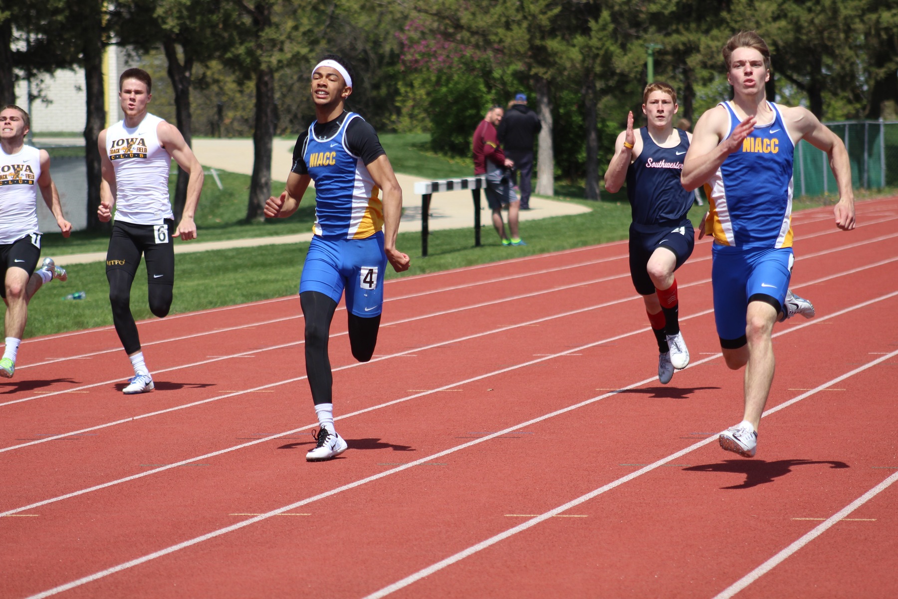NIACC's Brody Goos (right) and Andre McKinney run the 200-meter dash at the Dick Young Invitational Saturday. Goos won in 22.75 and McKinney was third in 22.90.