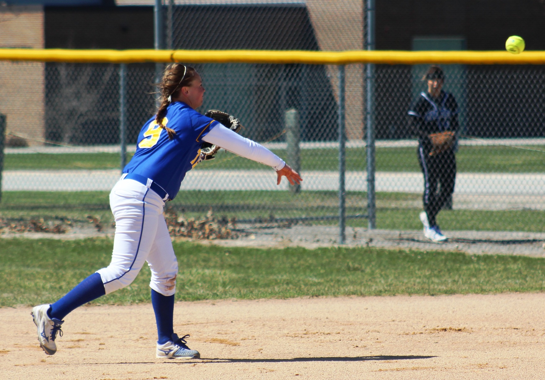 NIACC second baseman Brittany Florea throws out a runner at first base during the first game of an ICCAC doubleheader against DMACC on Thursday.