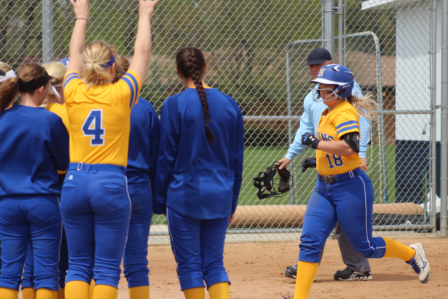 NIACC players celebrate as Shelby Low approaches home plate after hitting a solo home run in the third inning.