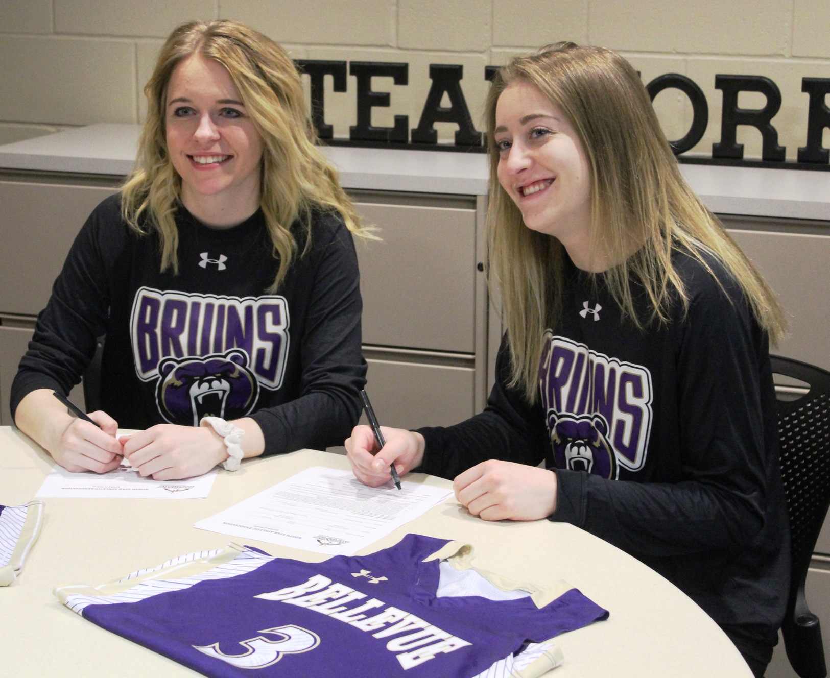 Riley Galvin (left) and Morgan Cuffe signed to play basketball next season at Bellevue University.