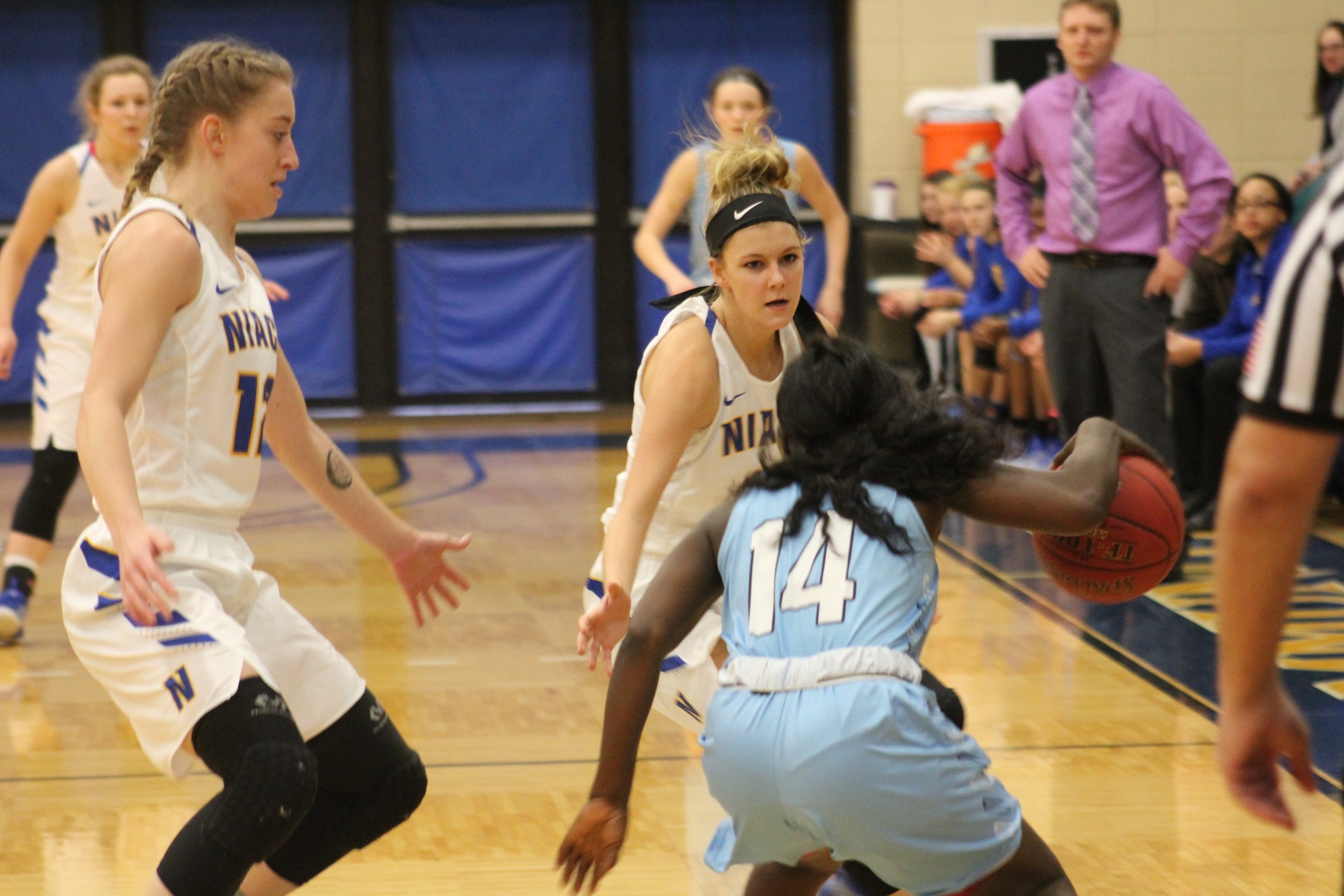 NIACC's Morgan Cuffe (left) and Taylor Laabs defend against Iowa Central's Rachel Toto during Saturday's contest.