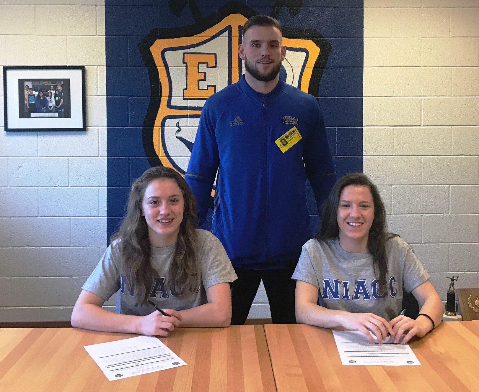 Lena Oliver (left) and Olga Oliver from Minneapolis recently signed a national letter of intent to play soccer at NIACC in the fall of 2017. NIACC coach pictured is Leo Driscoll.