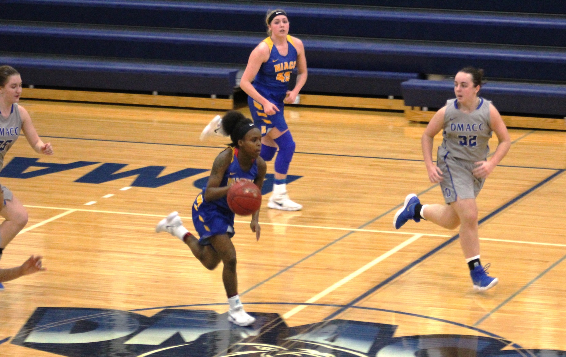 NIACC's UU Longs pushes the ball upcourt during Saturday's game at DMACC.