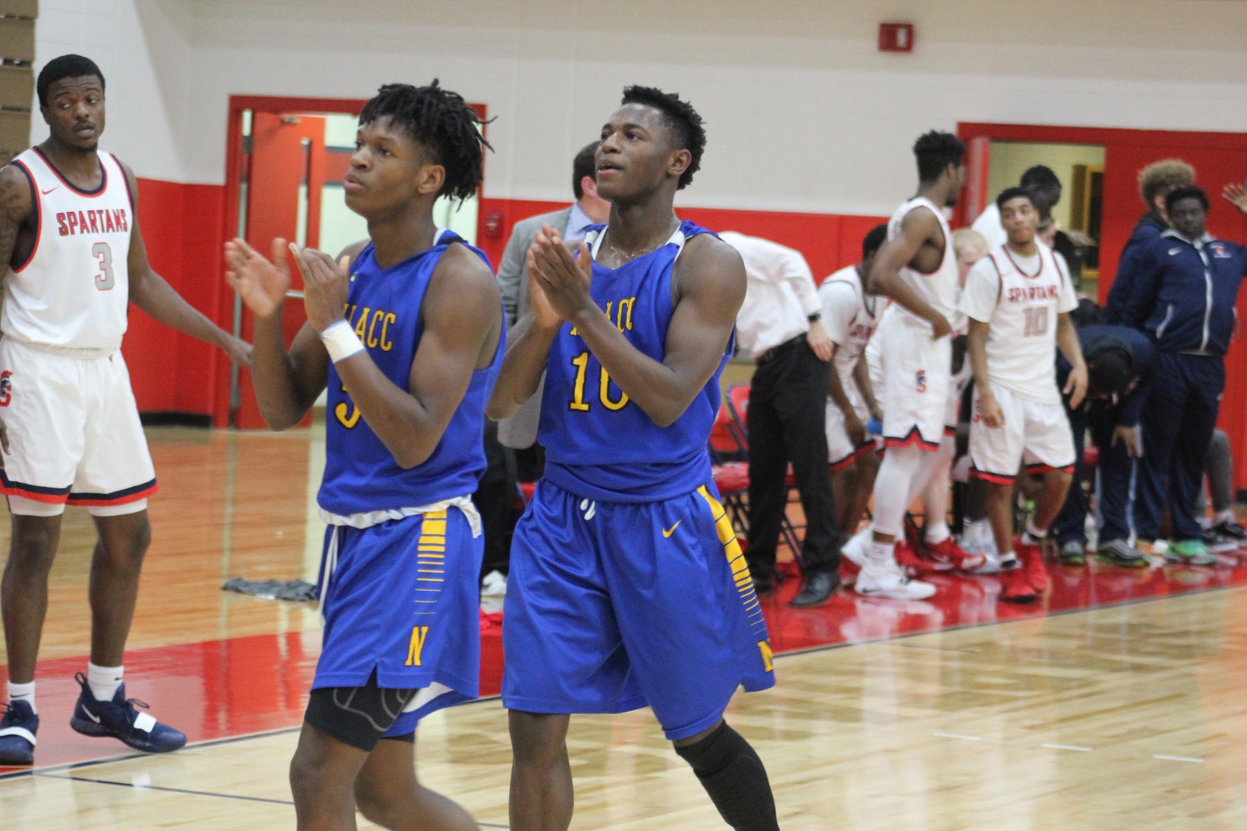 NIACC's Quintin Hardrict (left) and Deundra Roberson celebrate after Saturday's win over No. 2 Southwestern.