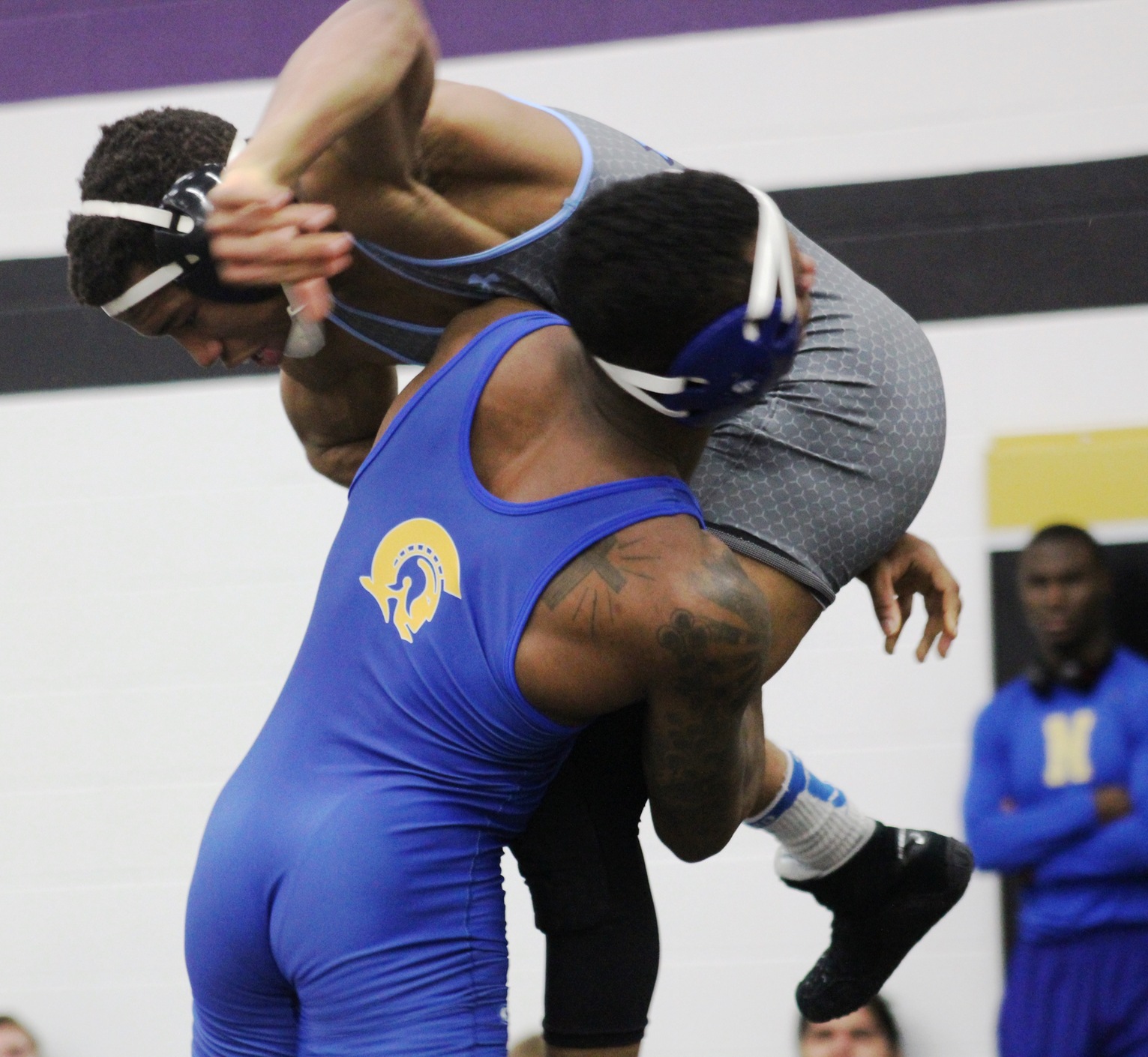 NIACC's Jamarius Jackson lifts Iowa Western's D'Andre Brumfield off the mat in their first round match at the NJCAA Central district tournament last Sunday.