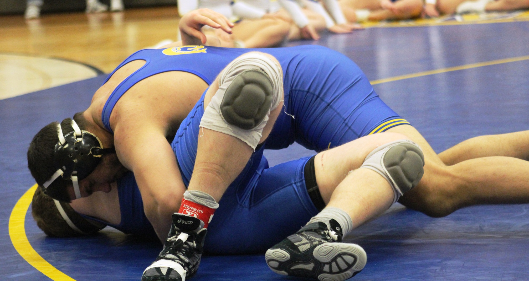 NIACC's Jimsher Sidhu works for the fall against Iowa Lakes' Montana Fuller in Friday's dual meet in the NIACC gym.