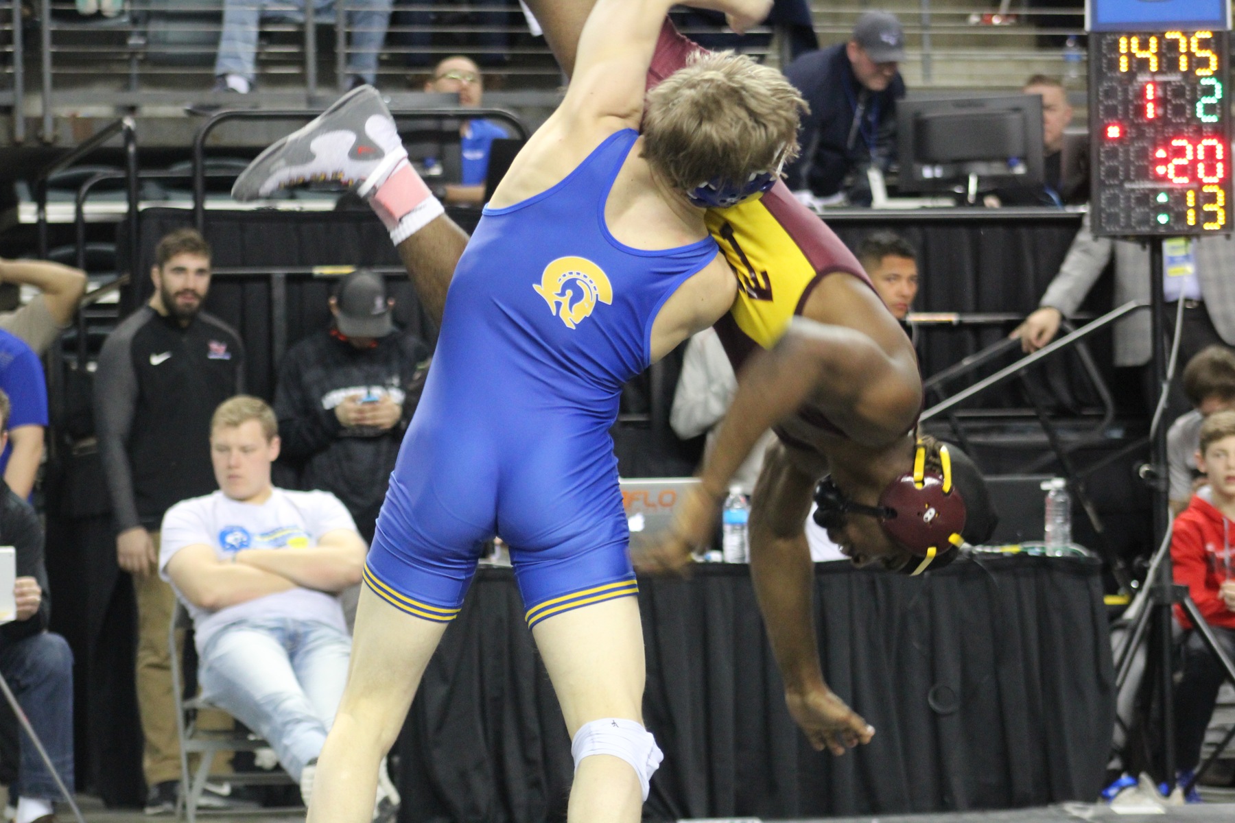 NIACC's Austin Anderly lifts Triton's Tyree Johnson in the air in their 141-pound semifinal match Saturday morning.