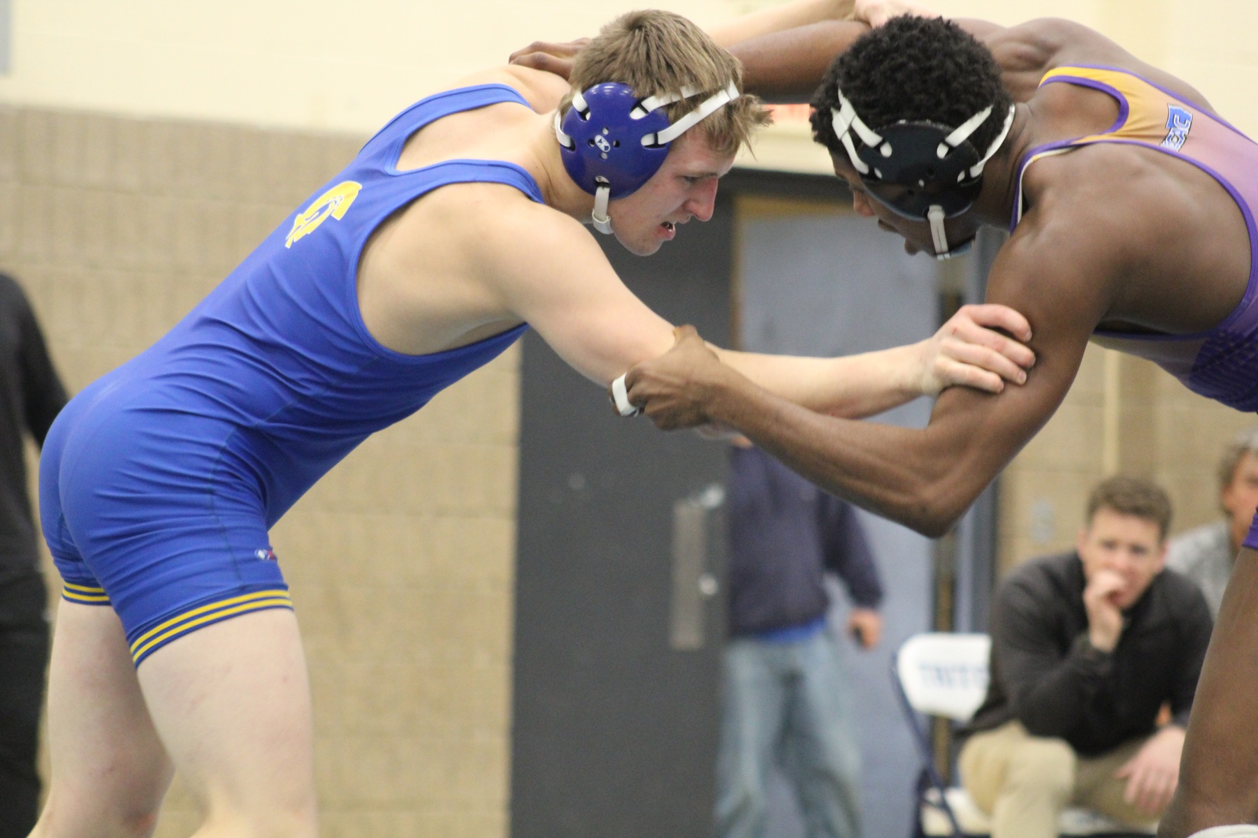 NIACC's Ryan Faught battles with Ellsworth's Myron Crawford in their 165-pound third-place match at the district tournament on Sunday.