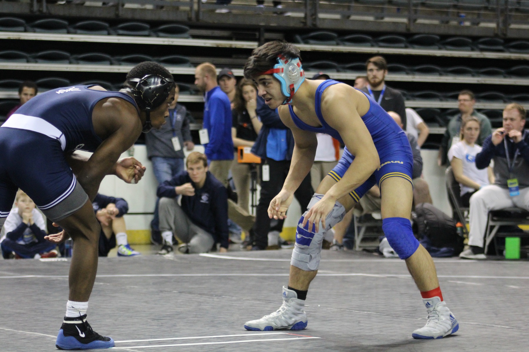 NIACC's Mark Gonzales battles with Iowa Central's Kevin Radcliff in 125-pound consolation match Friday. Gonzales won 8-4.