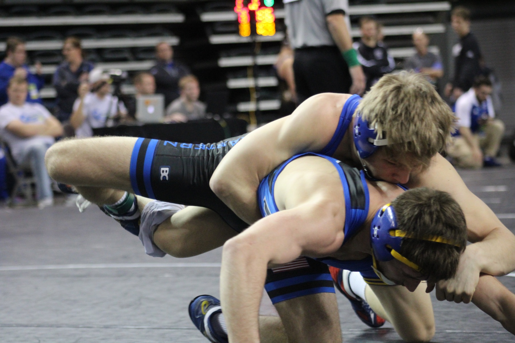 NIACC's Austin Anderly gets the takedown against NEO's Cody Karstetter in their 141-pound quarterfinal match Friday night at national tournament.
