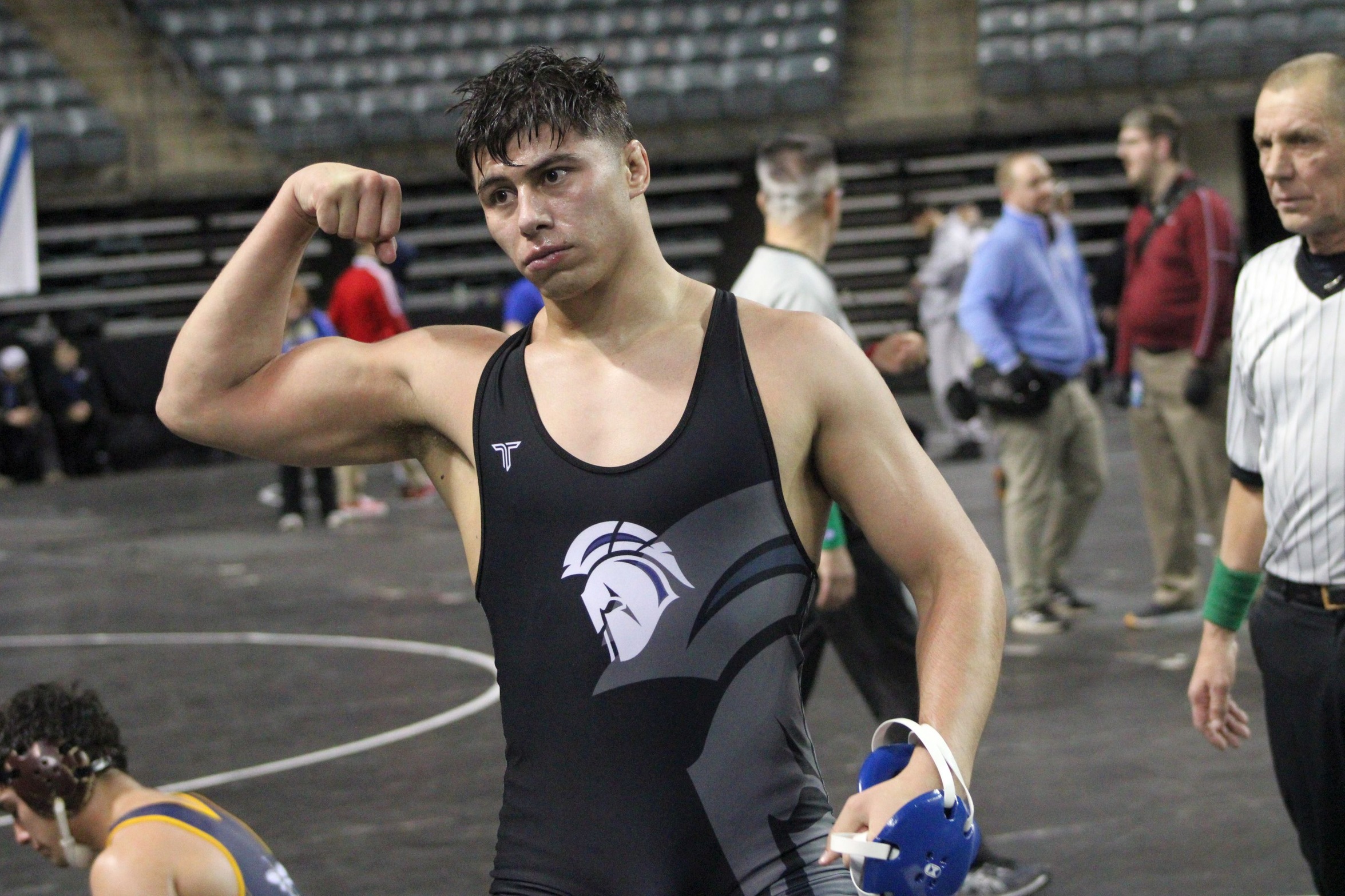 NIACC's Ein Carlos flexes after his 184-pound quarterfinal round win Friday night at the NJCAA national wrestling tournament in Council Bluffs.