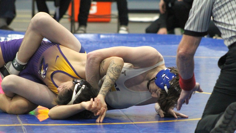 NIACC's Rhett Bonnette works for the fall over Austin Kaalekehi in their 125-pound match Wednesday in the NIACC recreation center.