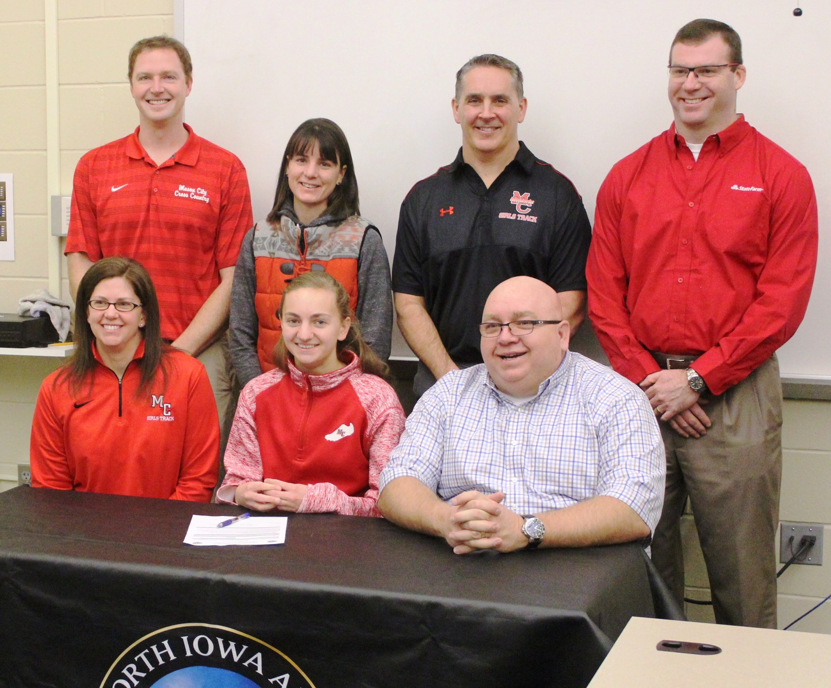 Mason City's Emma Davison signed a national letter of intent Wednesday morning to run cross country and track and field at NIACC.