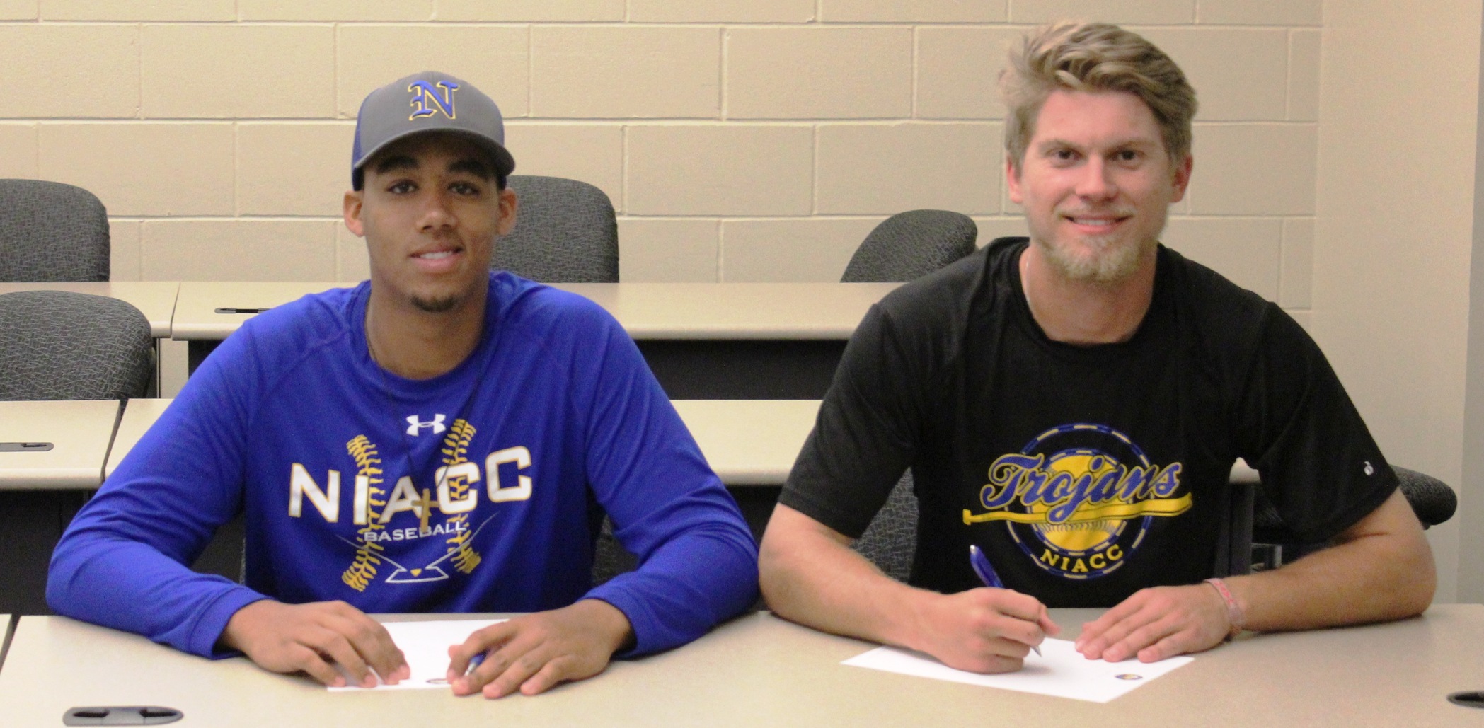 Ryan Huntington (left) signed with Grambling State and Connor Enochs signed with Southern Illinois-Edwardsville.