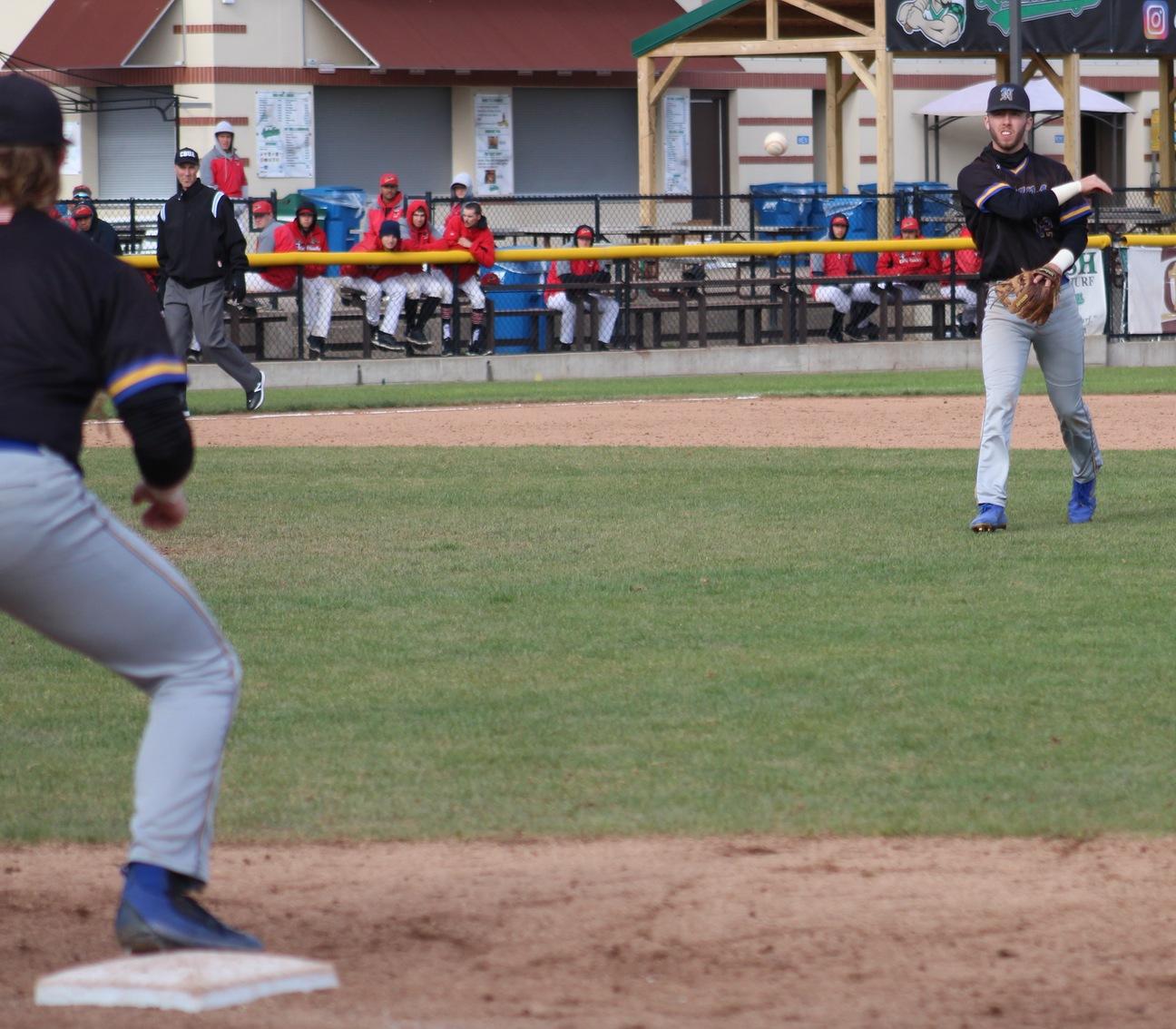 NIACC shortstop Jake Hansen throws to first baseman Jake Hansen for an out in Saturday's game against DMACC.