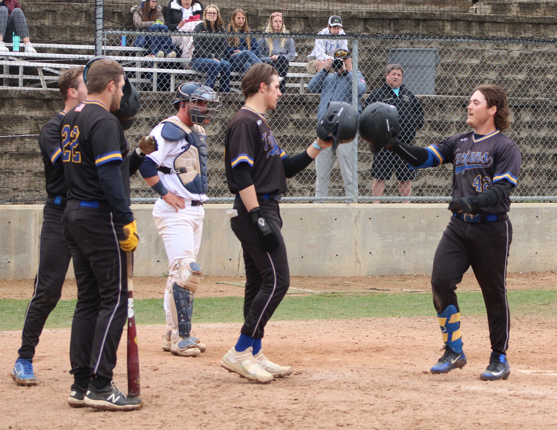 NIACC's Cayden Nicoletto is congratulated at home plate after hitting his second home run Tuesday against Iowa Central.