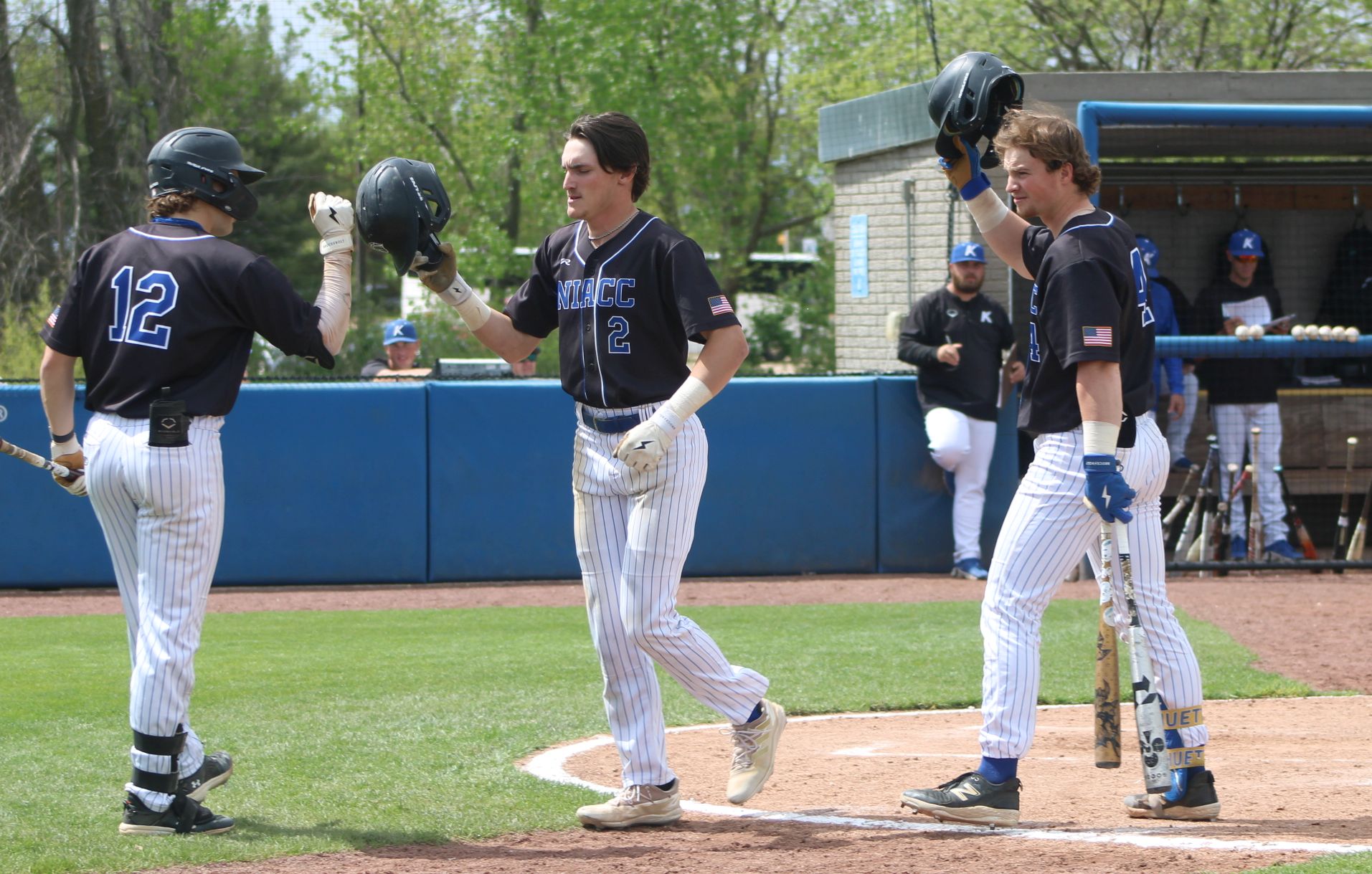NIACC's Eli Anderson is congratulated by teammates after hitting a solo home run in the fifth inning of Wednesday's first game of doubleheader against Kirkwood.