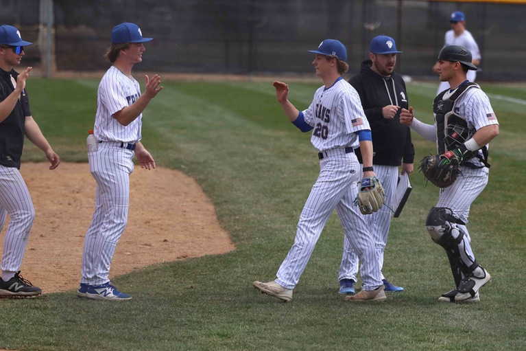 NIACC's Ethen Roberts gets congratulated during Wednesday's home game against Southwestern at Roosevelt Field.