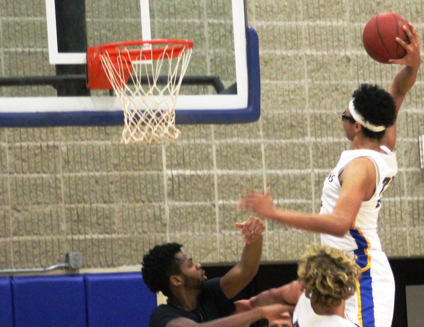 NIACC's Trey Sampson throws down 2 of his 19 points in Tuesday's tournament game.