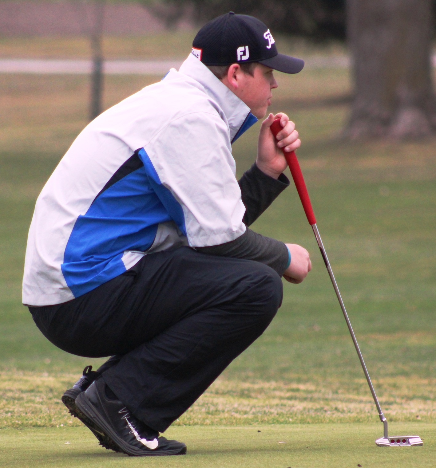 NIACC sophomore Devin Koob lines up a putt at a tournament earlier this season.