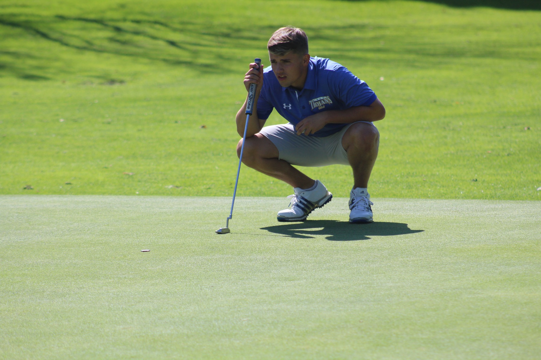 Jackson Hamlin lines up a putt at the NIACC Invitational on Monday at the Mason City Country Club.