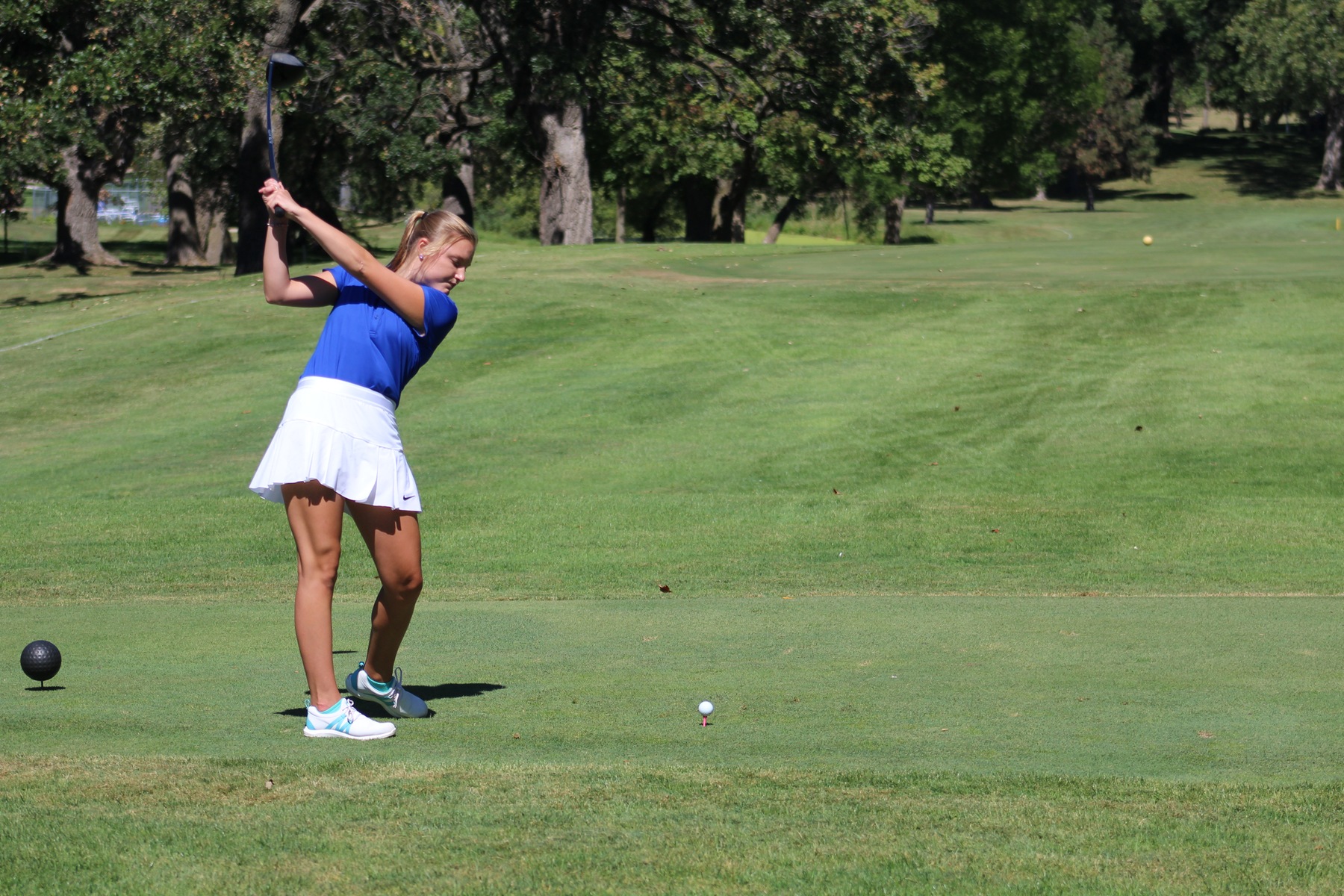 NIACC's Thea Lunning tees off at the Iowa Lakes Invitational on Friday in Okoboji.