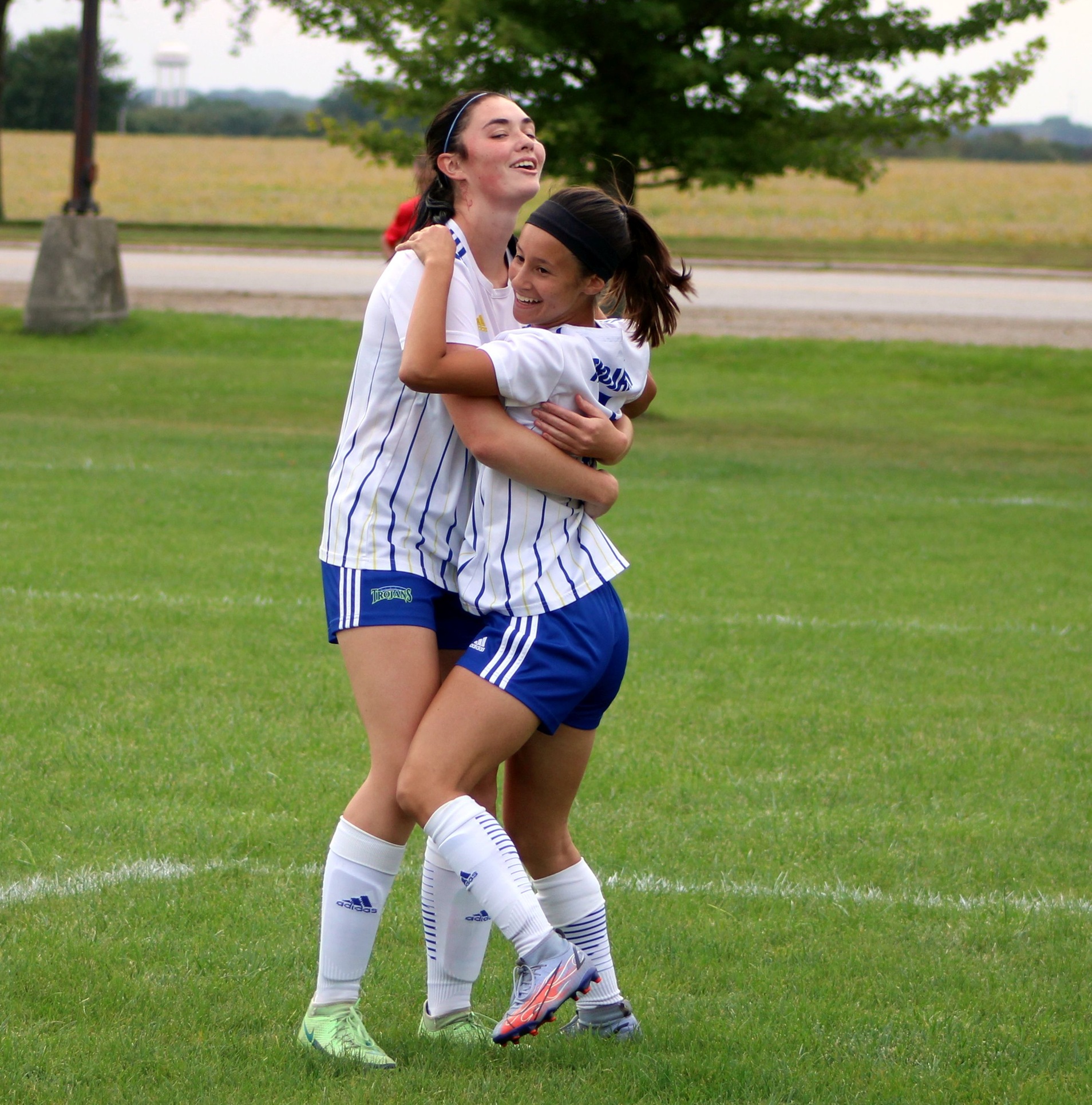 Maria Paz Gimenez Villamil (right) celebrates her first half goal with teammate Brianna Marchand in Saturday's match against Scott CC.