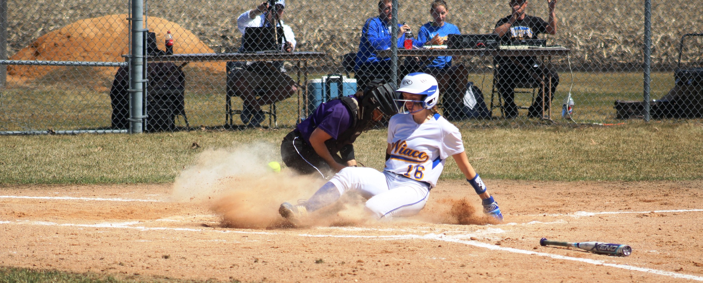 NIACC's Morgan Thesing-Ritter slides in safely at home after hitting an inside-the-park home run in the third inning of Wednesday's first game against Ellsworth.