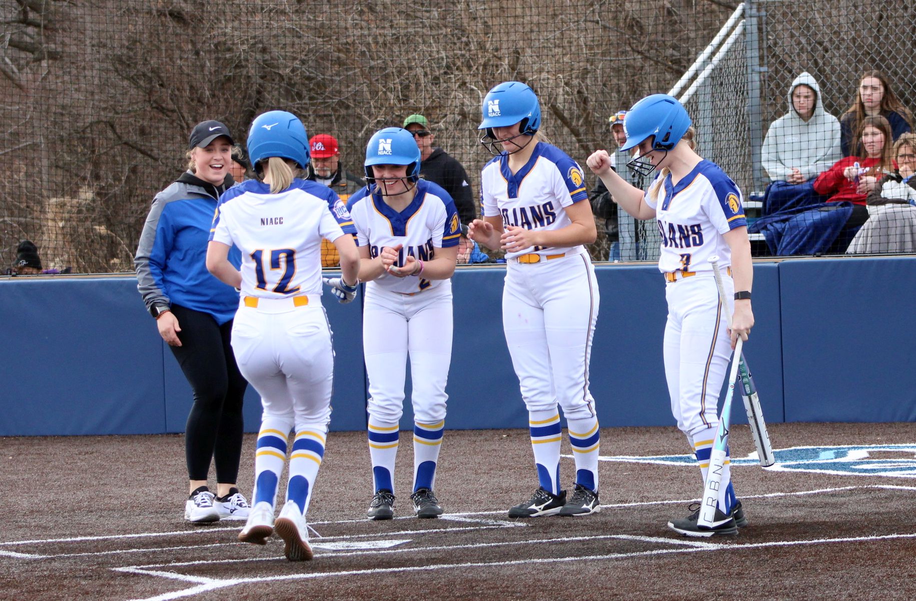 Brynnlin Kroymann (12) crosses home plate after hitting a 3-run home run in Sunday's second game of a doubleheader at Iowa Western.