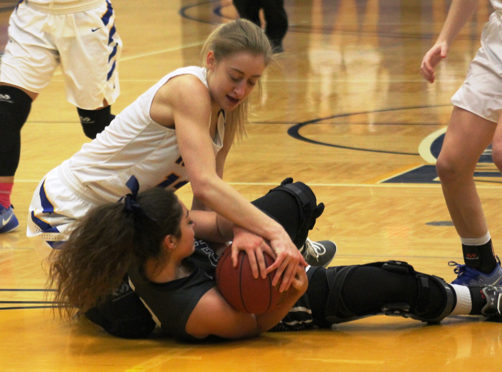 NIACC's Morgan Cuffe fights for a loose ball during a game earlier this season against Marshalltown CC.