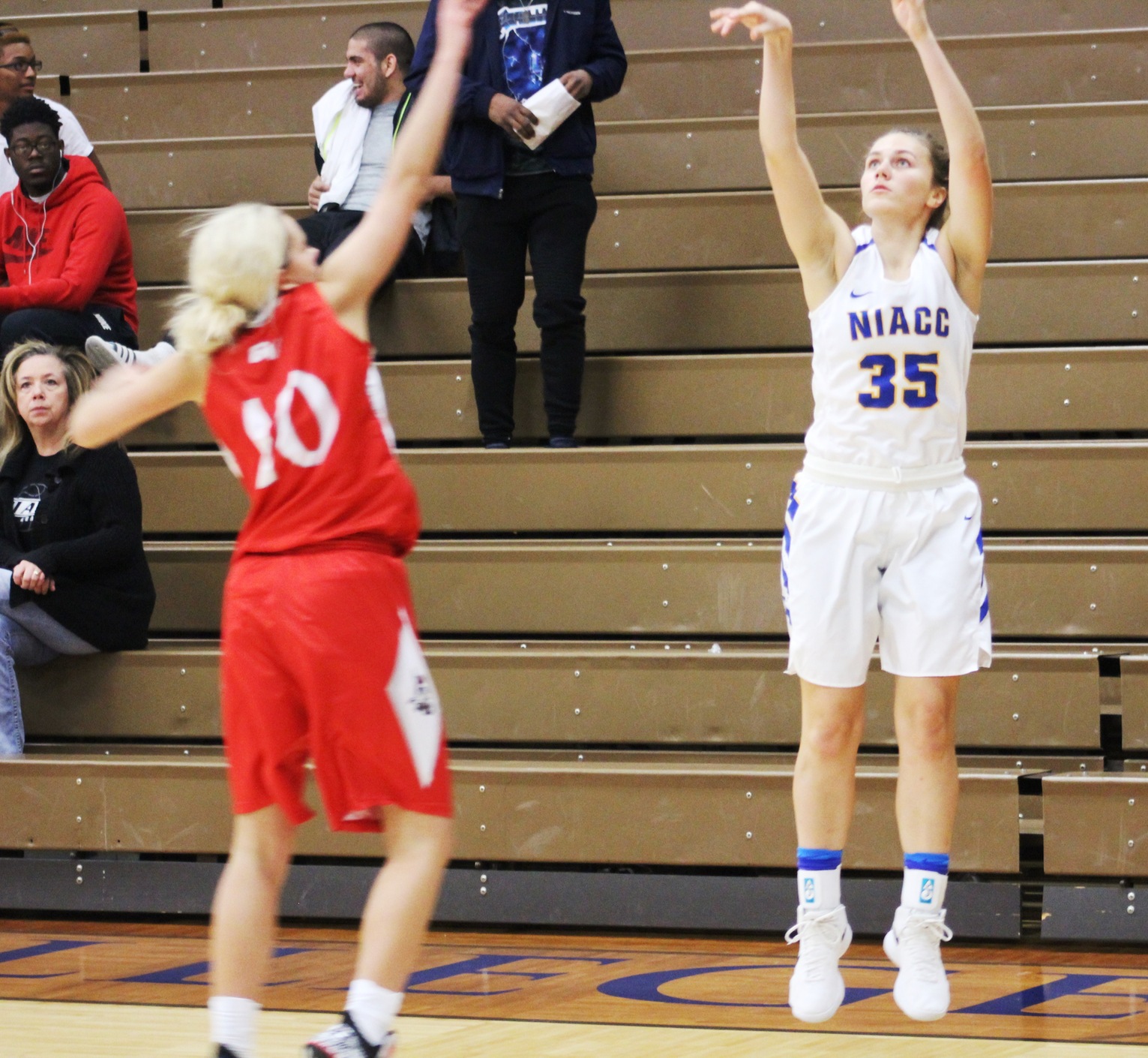 Kelsie Willert connects on a 3-point goal in the second half of Sunday's game against the Grand View Junior Varsity.