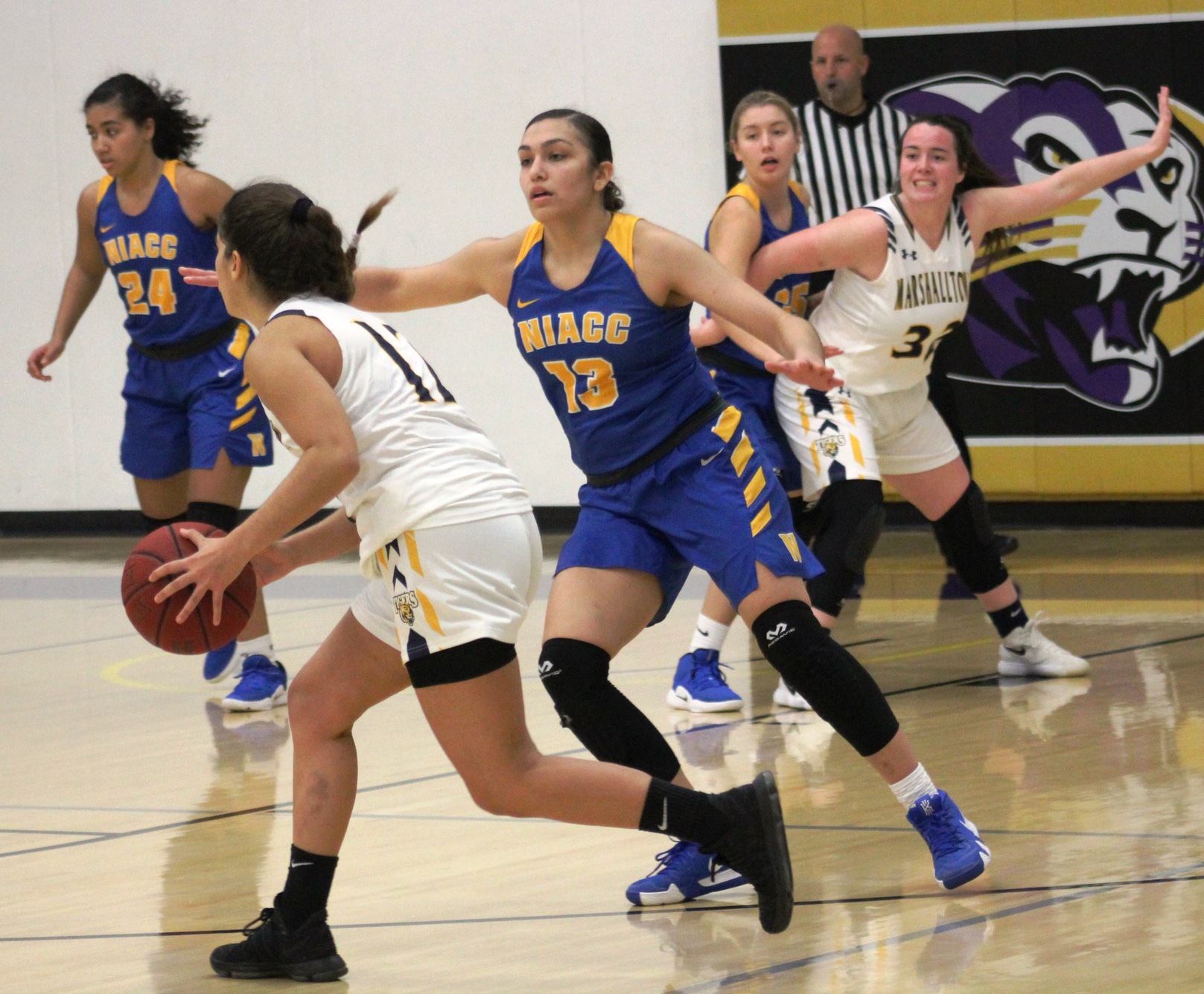 The Lady Trojans play defense against MCC at the Dale Howard Classic earlier this season.