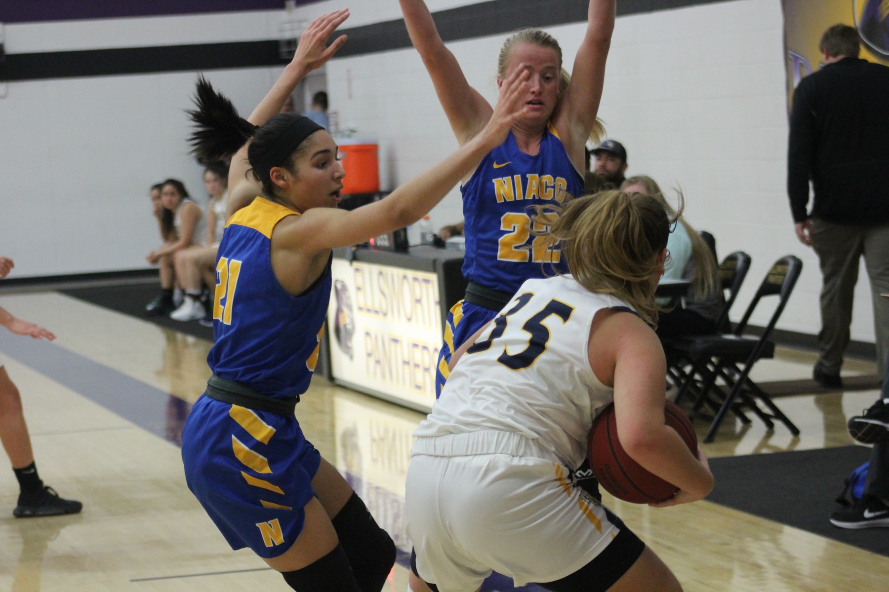 NIACC's Jada Buford (left) and Alexa Loftus defend in second half of Friday's game against Marshalltown CC.