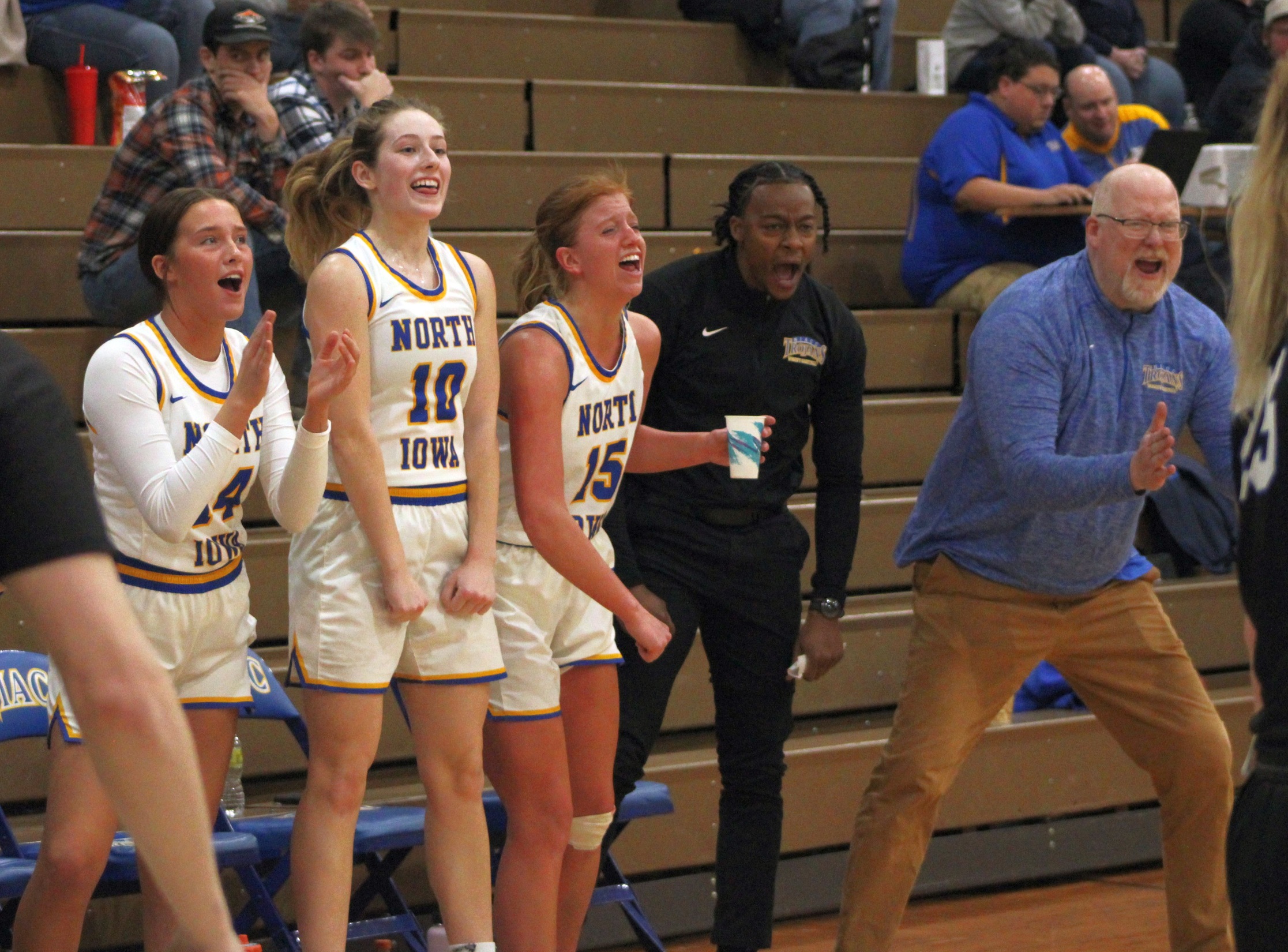 The NIACC bench celebrates a basket late in Monday's win over DMACC.