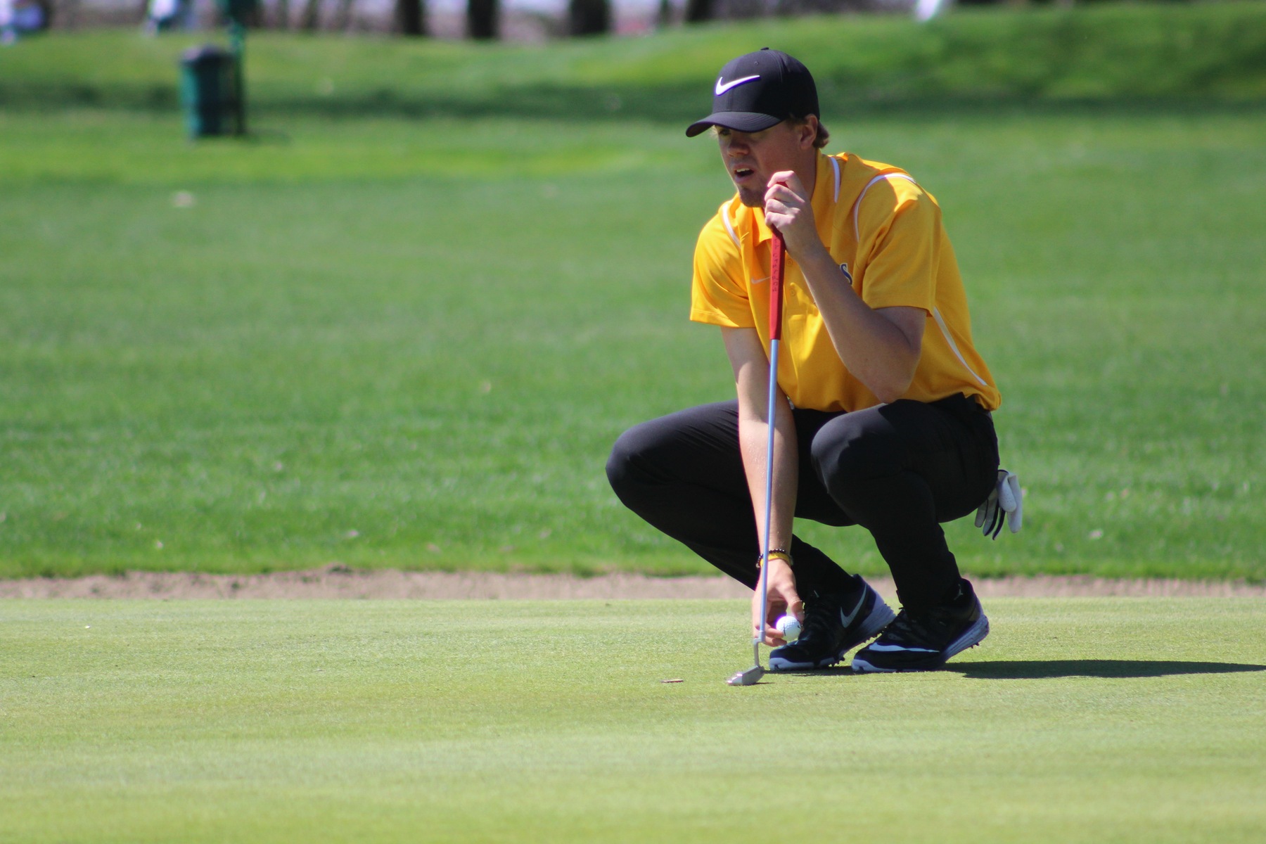 Joe Nordquist lines up a putt at the NIACC Invitational on Monday at the Mason City Country Club.