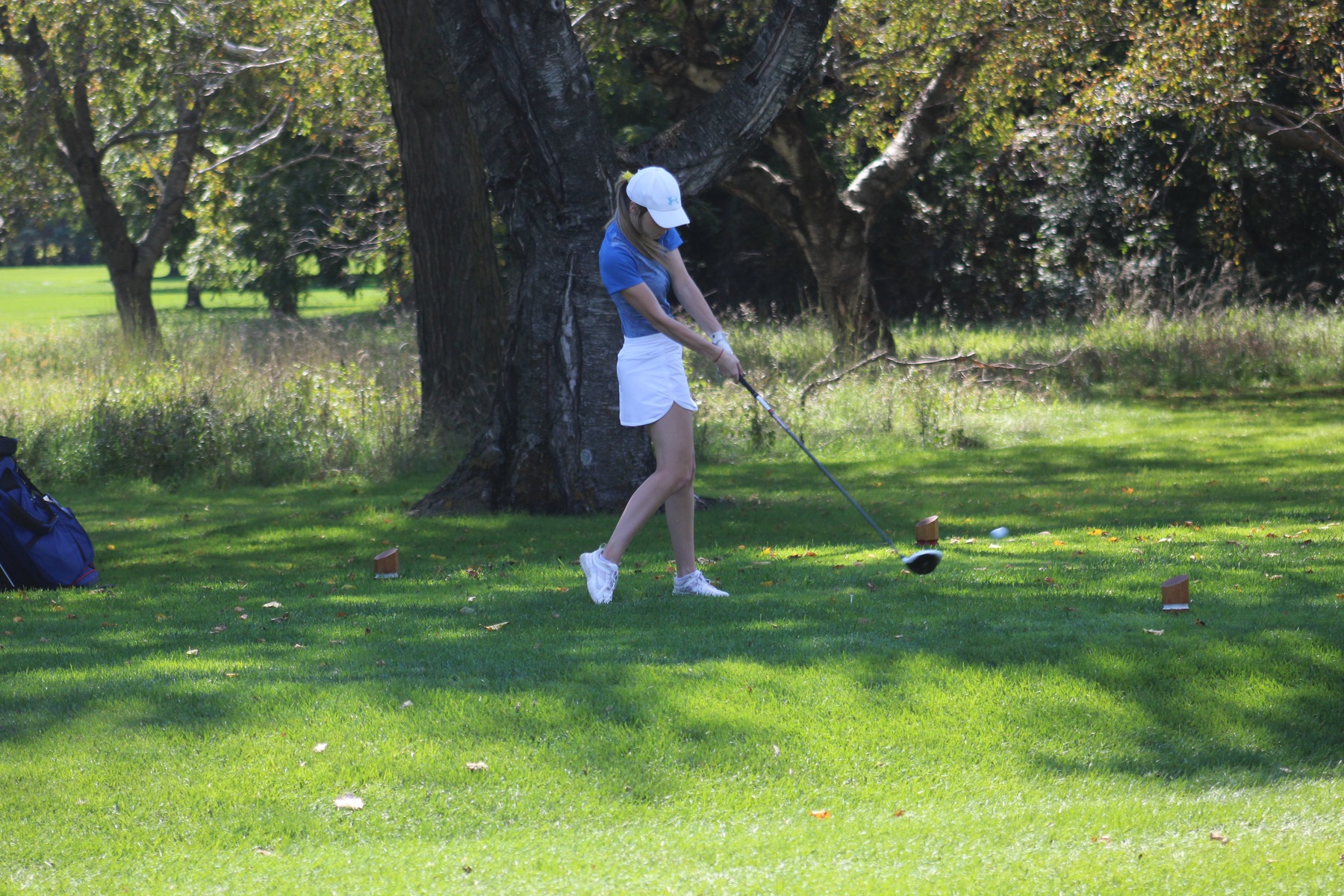 Sydney Fullerton tees off at the NIACC Invitational on Monday at the Mason City Country Club.