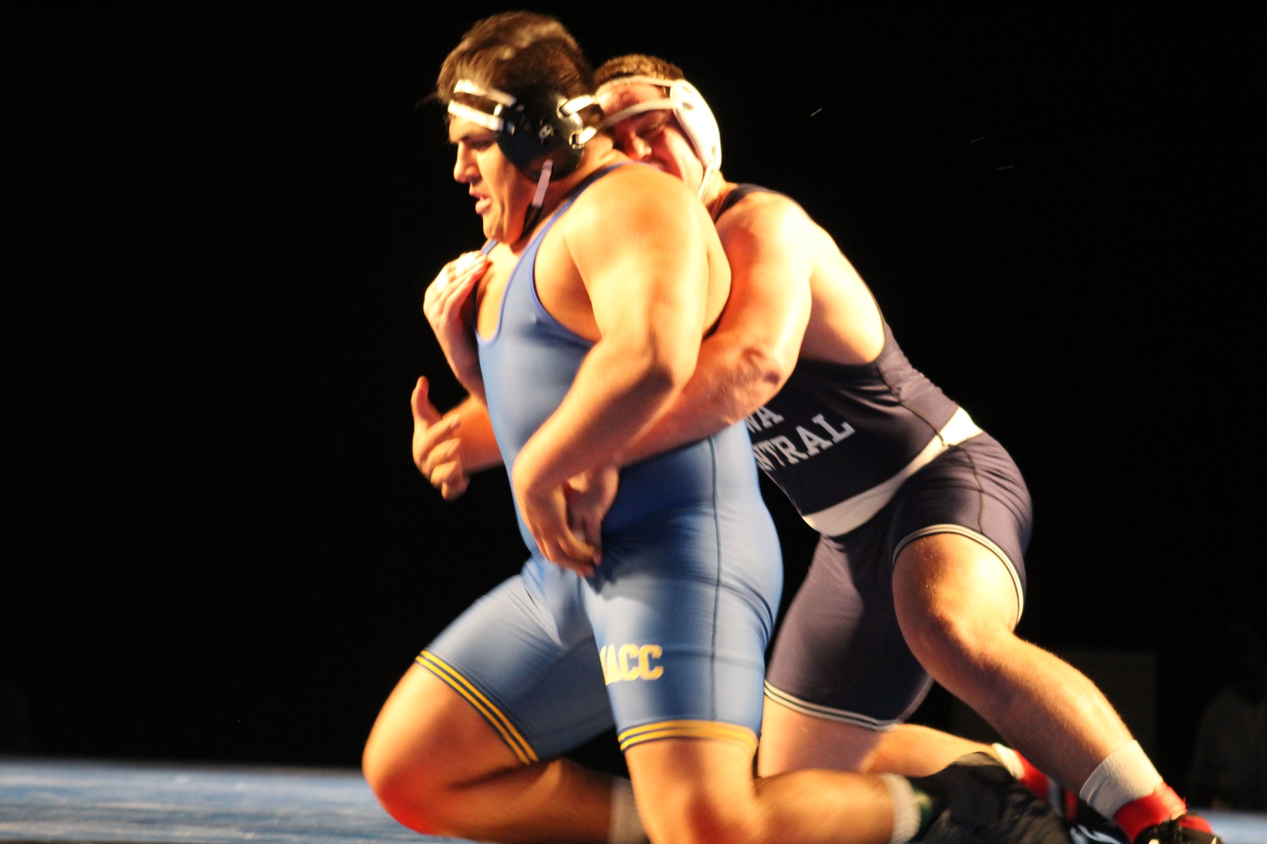 Mario Pena tries to escape from Iowa Central's Thomas Petersen in the 285-pound title bout Saturday night.