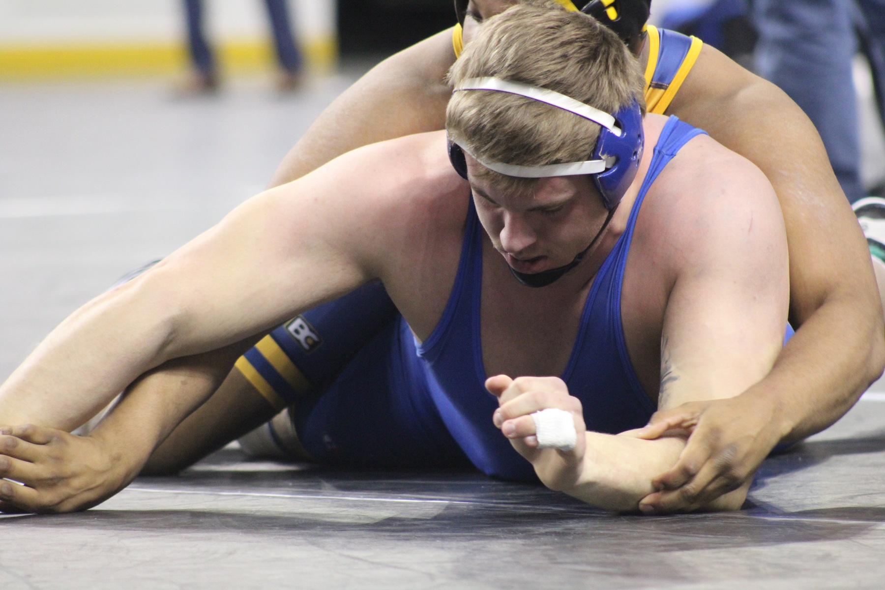 NIACC's Zach Santee tries to escape from Northeastern's Antonio Andrade in the 285-pound semifinals.