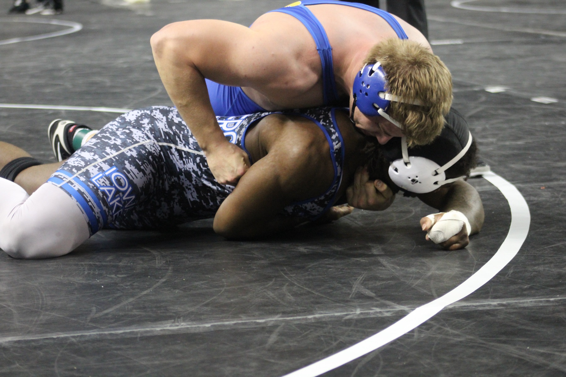 NIACC's Zach Santee controls Iowa Lakes' Andre Bissainthe in their 285-pound fifth-place match at the national tournament.