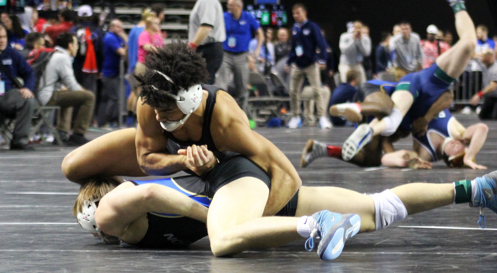 NIACC's Christian Minto controls Barton's Andrew Dearmond in a 165-pound match at the national tournament on Friday.