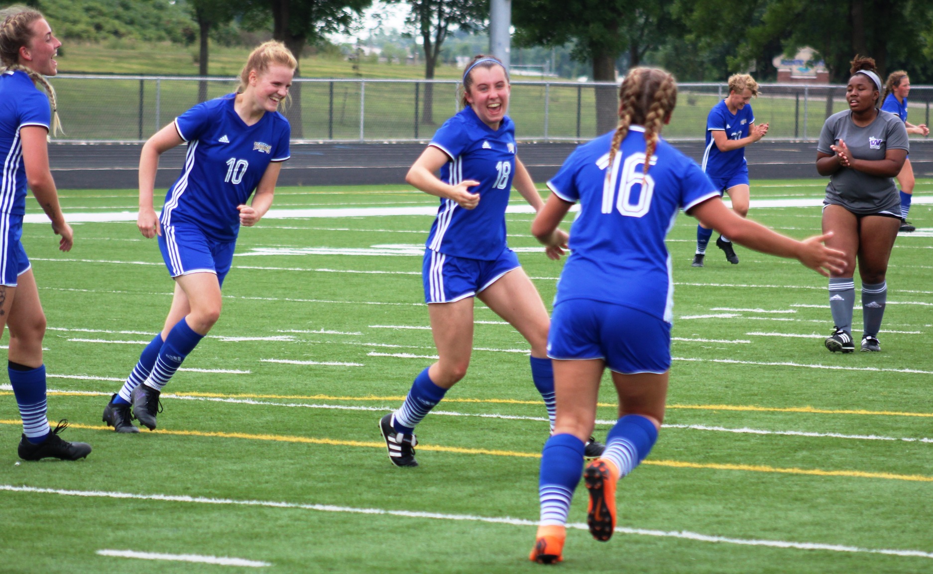 NIACC celebrates a goal scored by Milly Jay (18) during Wednesday's scrimmage against Waldorf University.